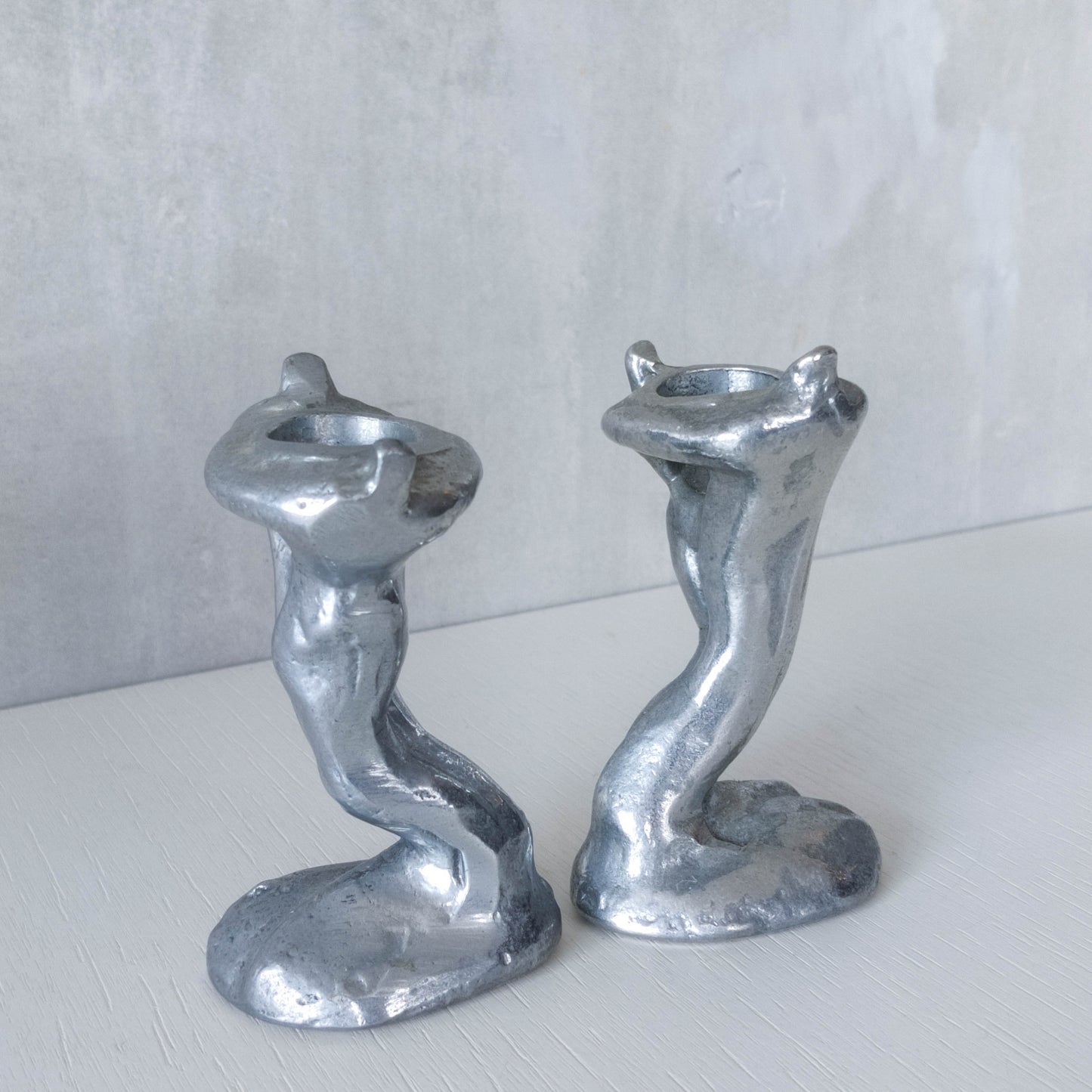 Pair of vintage 1980s ART3 David Marshall style cast aluminum brutalist candle holders