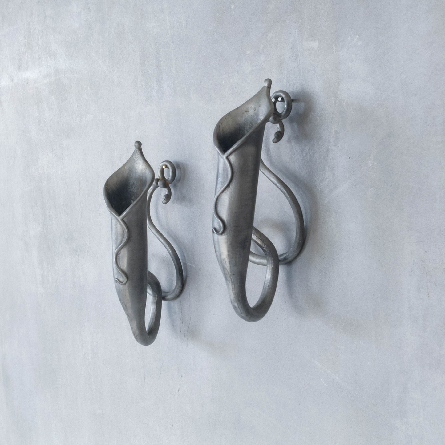 Pair of vintage handmade pewter candle holder wall sconces