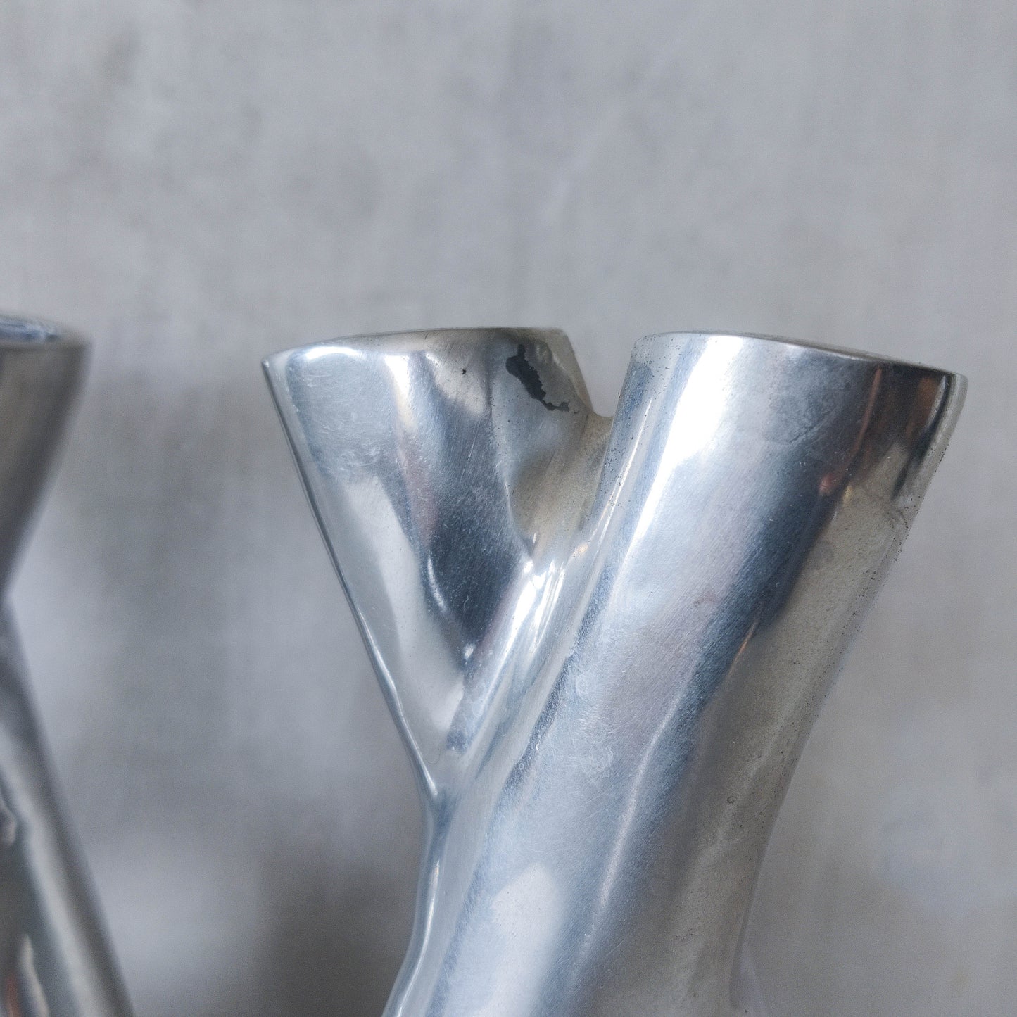 Pair of vintage cast aluminium sculptural donut twist vases