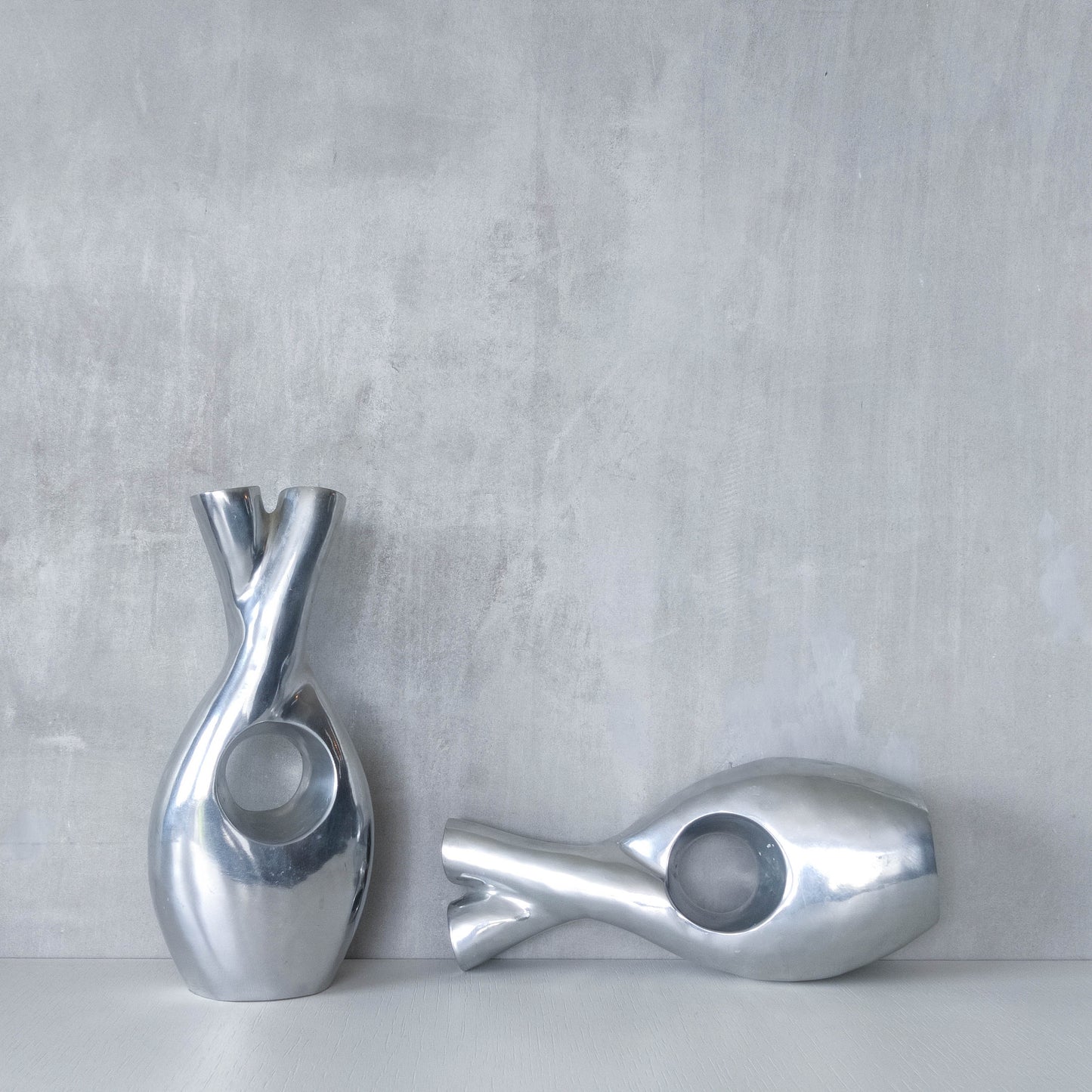 Pair of vintage cast aluminium sculptural donut twist vases