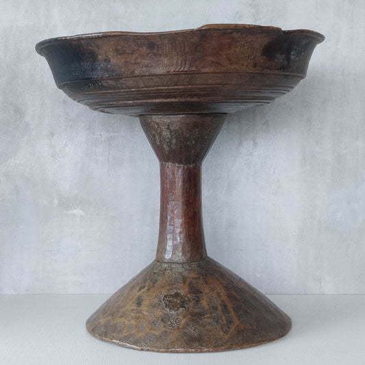 A large sculptural carved and turned vintage wooden pedestal bowl