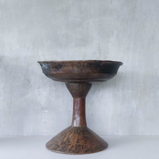 A large sculptural carved and turned vintage wooden pedestal bowl