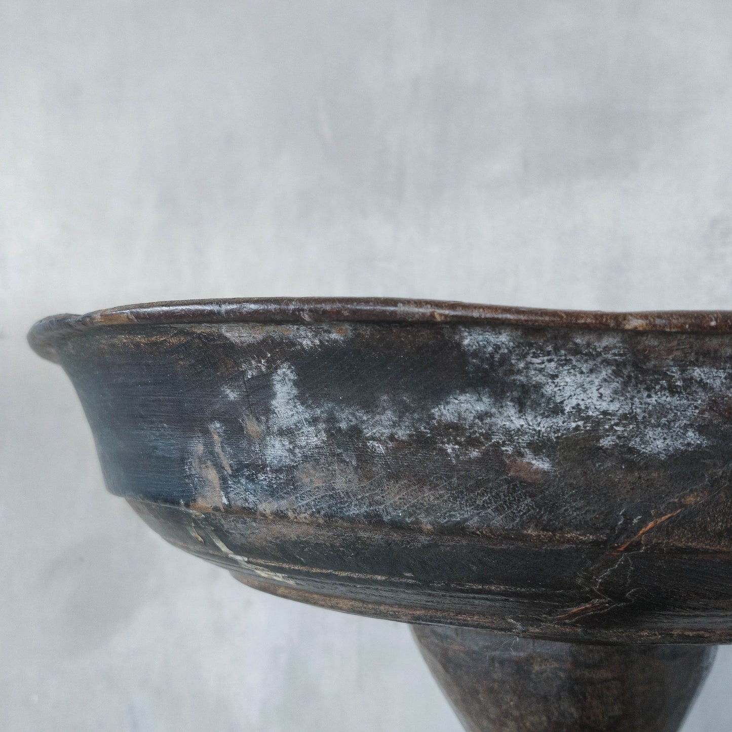 A large sculptural carved and turned vintage wooden pedestal bowl