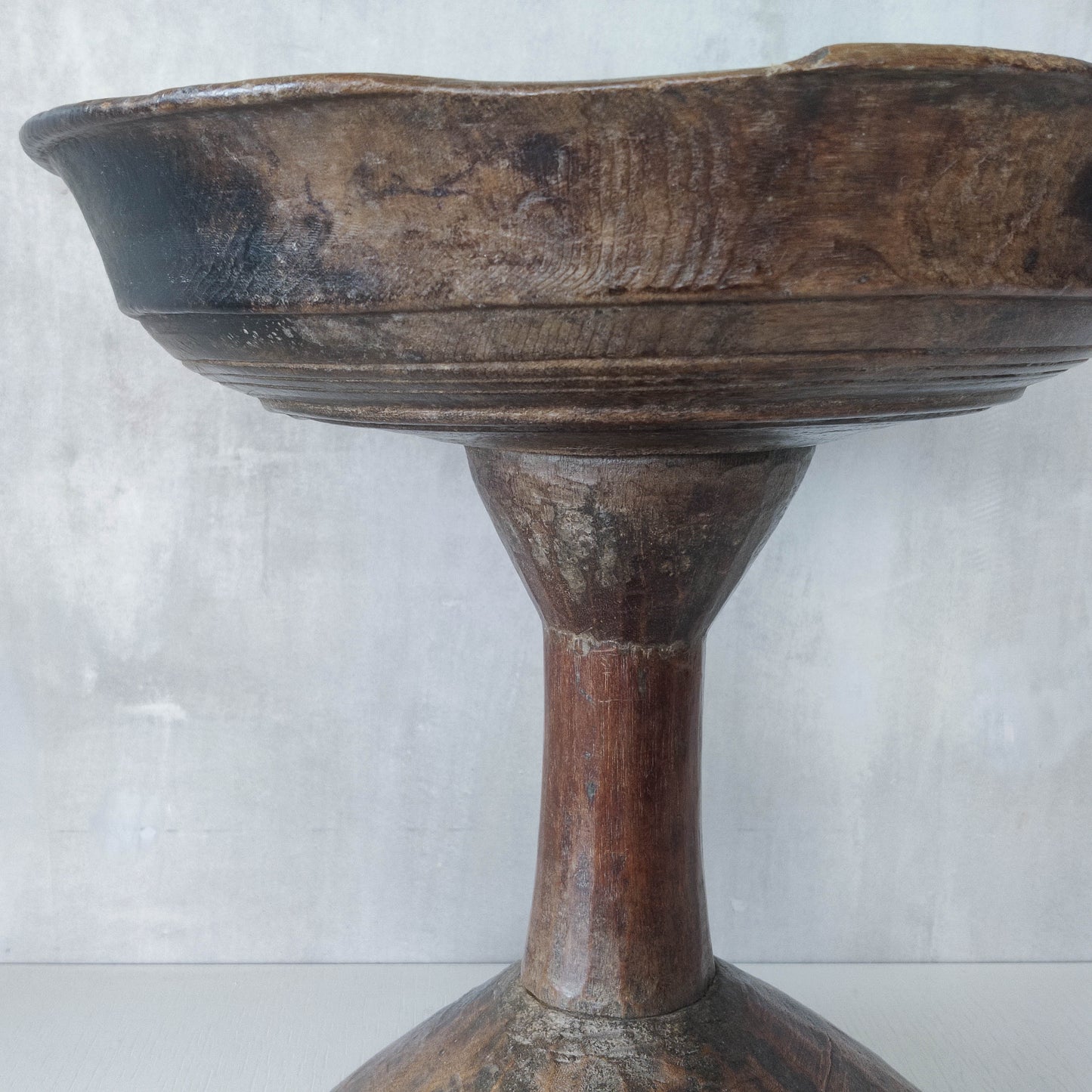 A large sculptural carved and turned vintage wooden pedestal bowl