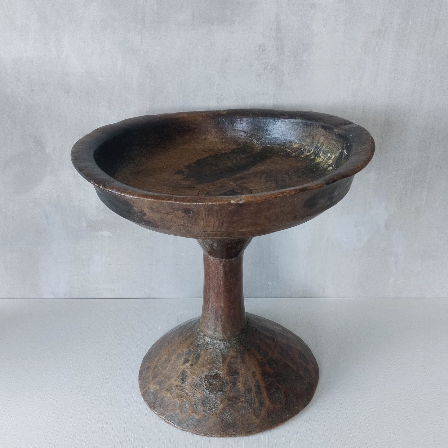 A large sculptural carved and turned vintage wooden pedestal bowl