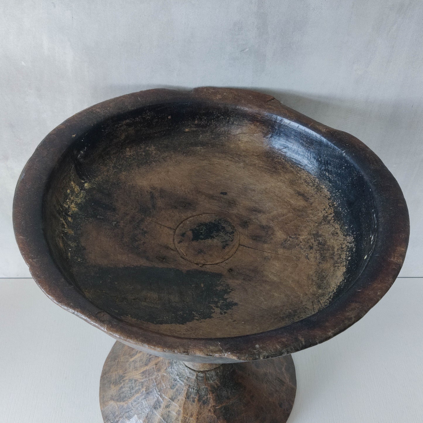 A large sculptural carved and turned vintage wooden pedestal bowl
