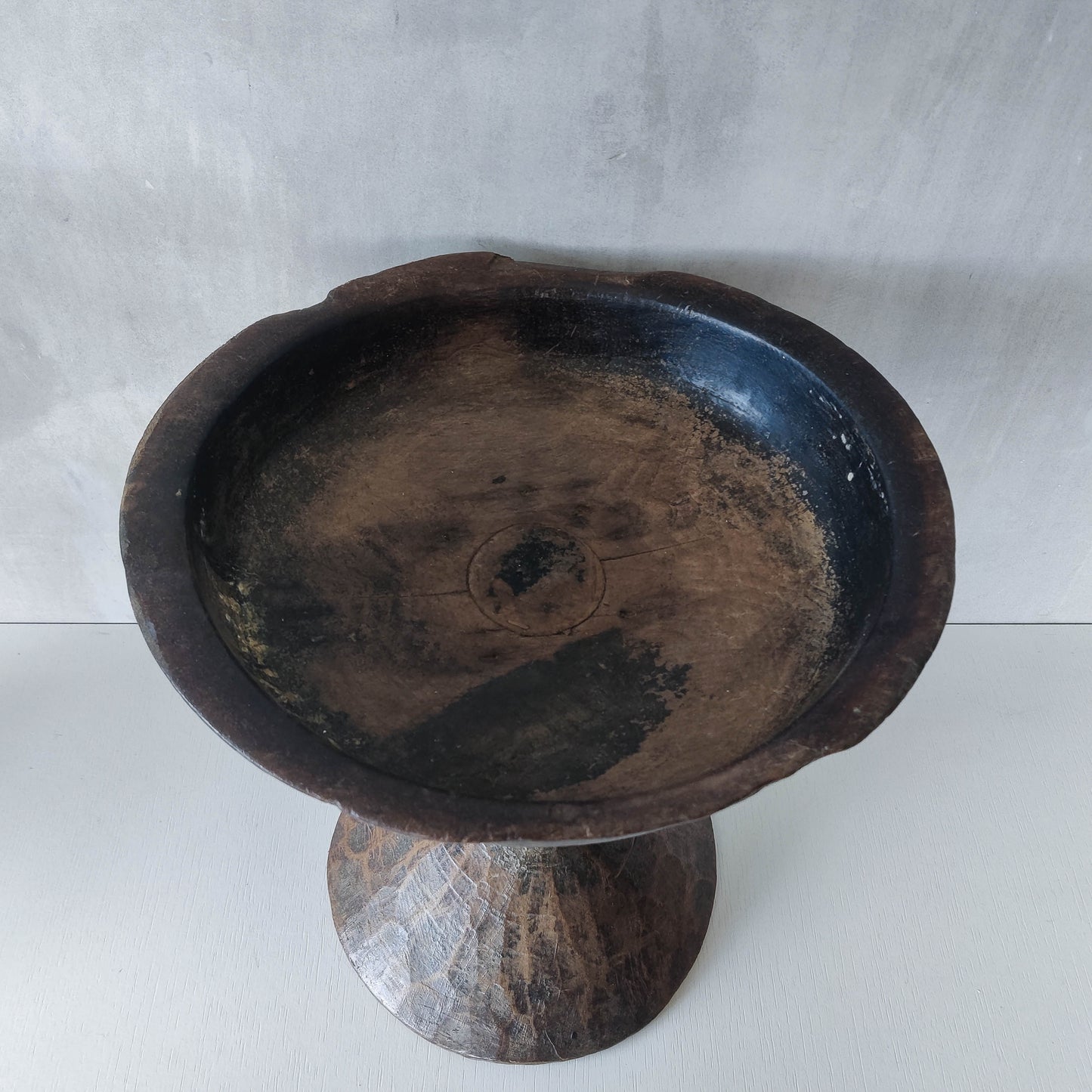 A large sculptural carved and turned vintage wooden pedestal bowl