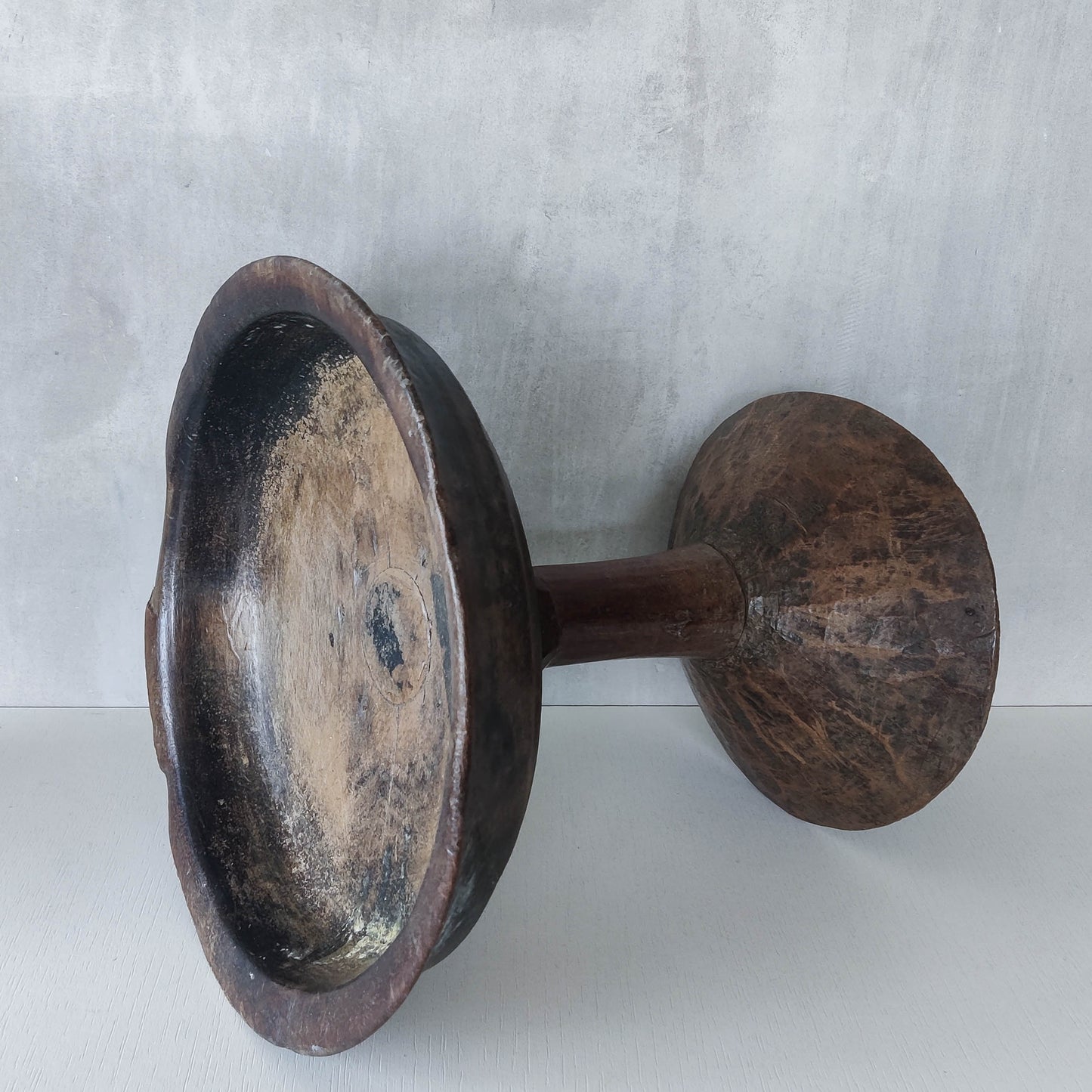 A large sculptural carved and turned vintage wooden pedestal bowl
