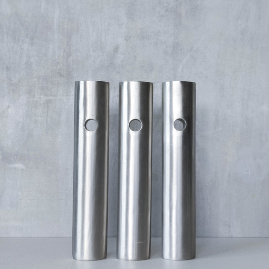 Trio of vintage artist made spun steel sculptural donut void bud vases