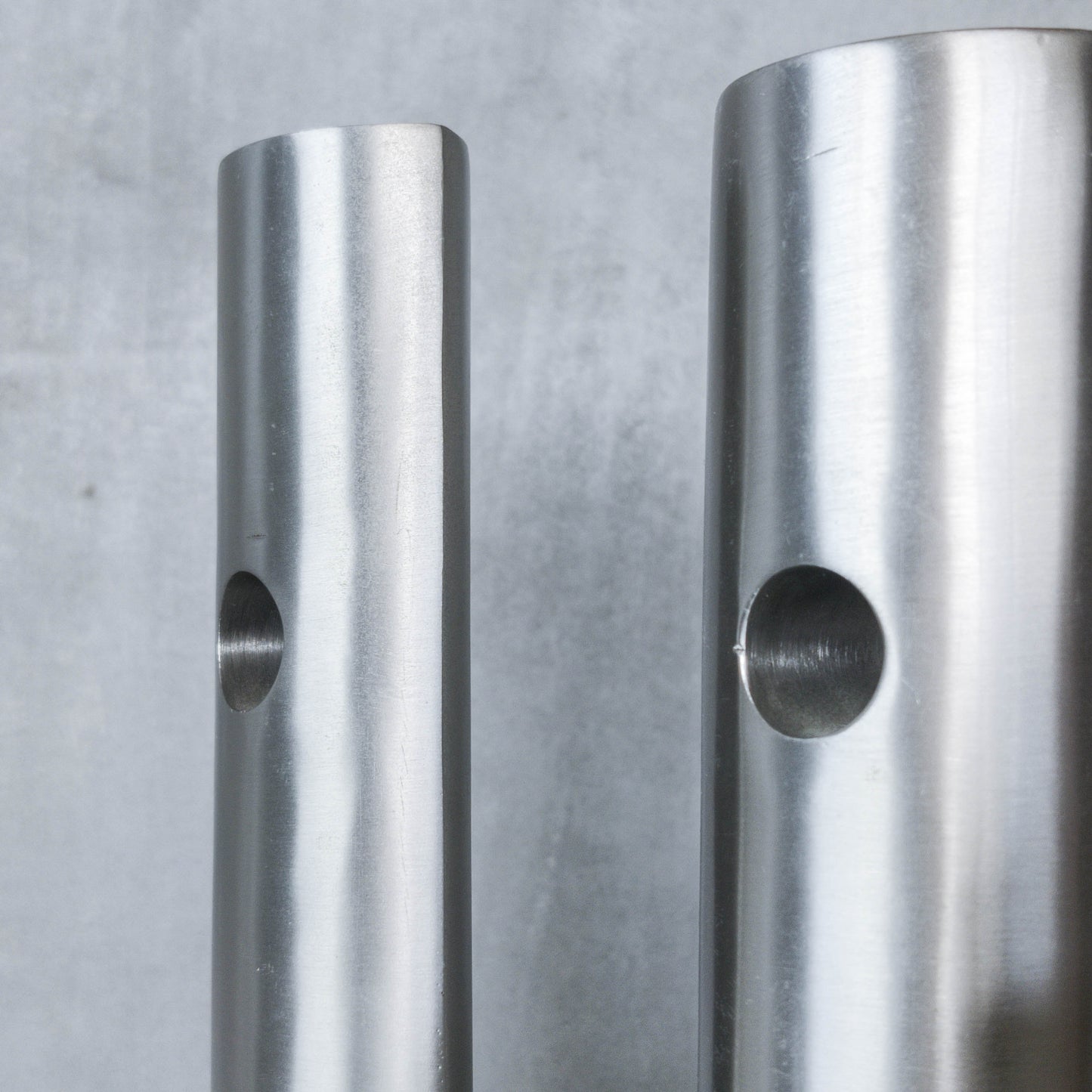 Trio of vintage artist made spun steel sculptural donut void bud vases