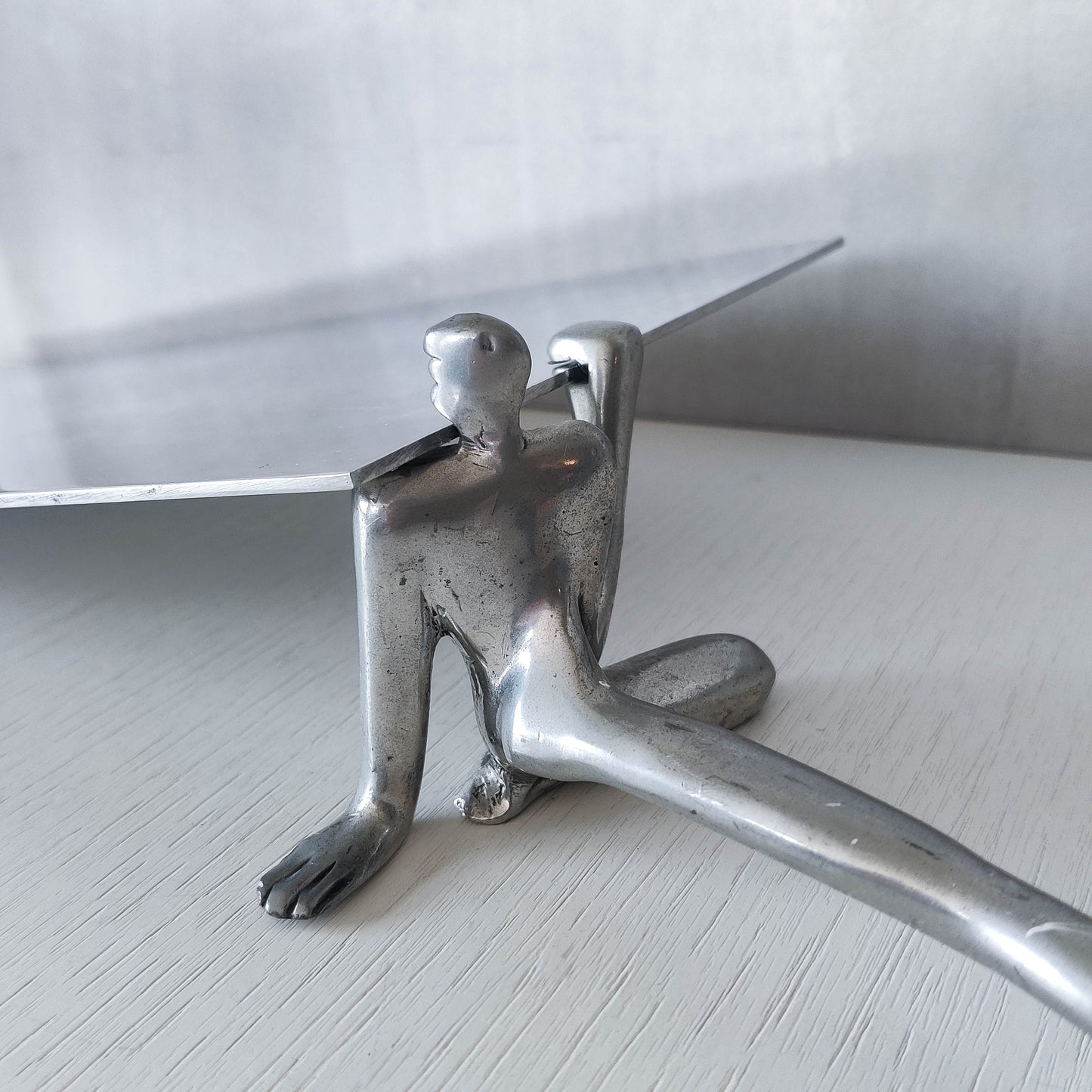 Carrol Boyes vintage 00s cast pewter and folded steel figural book display stand