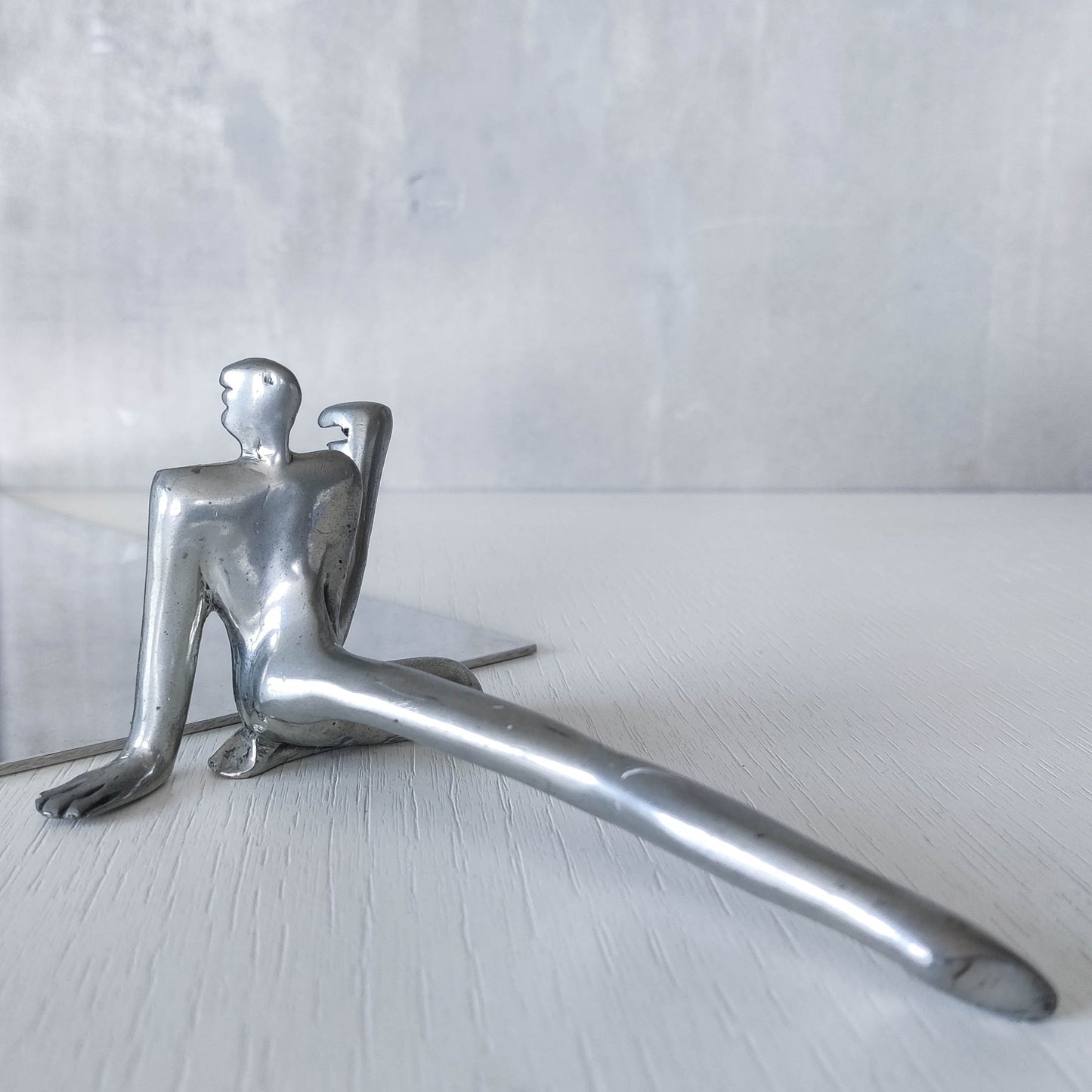 Carrol Boyes vintage 00s cast pewter and folded steel figural book display stand