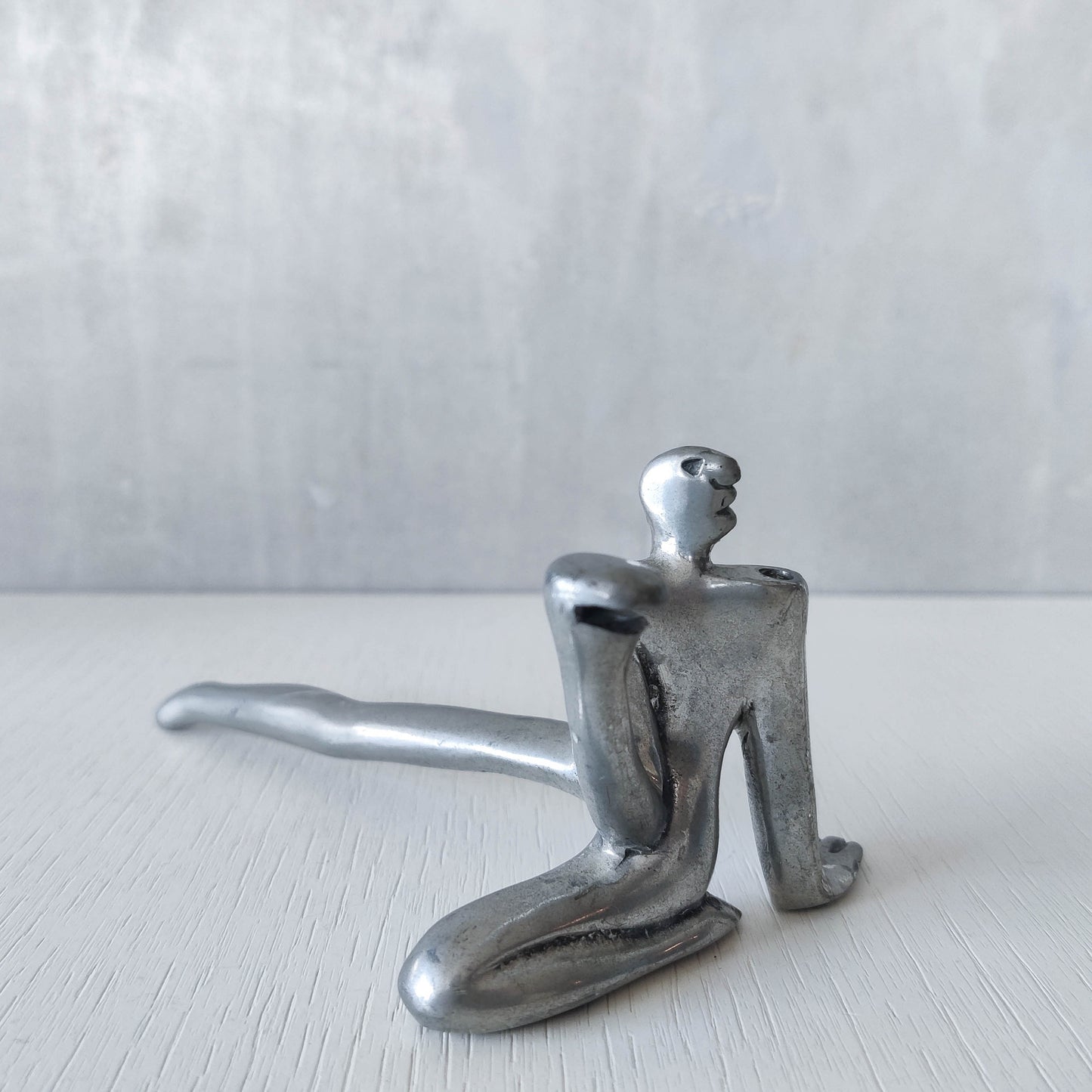 Carrol Boyes vintage 00s cast pewter and folded steel figural book display stand