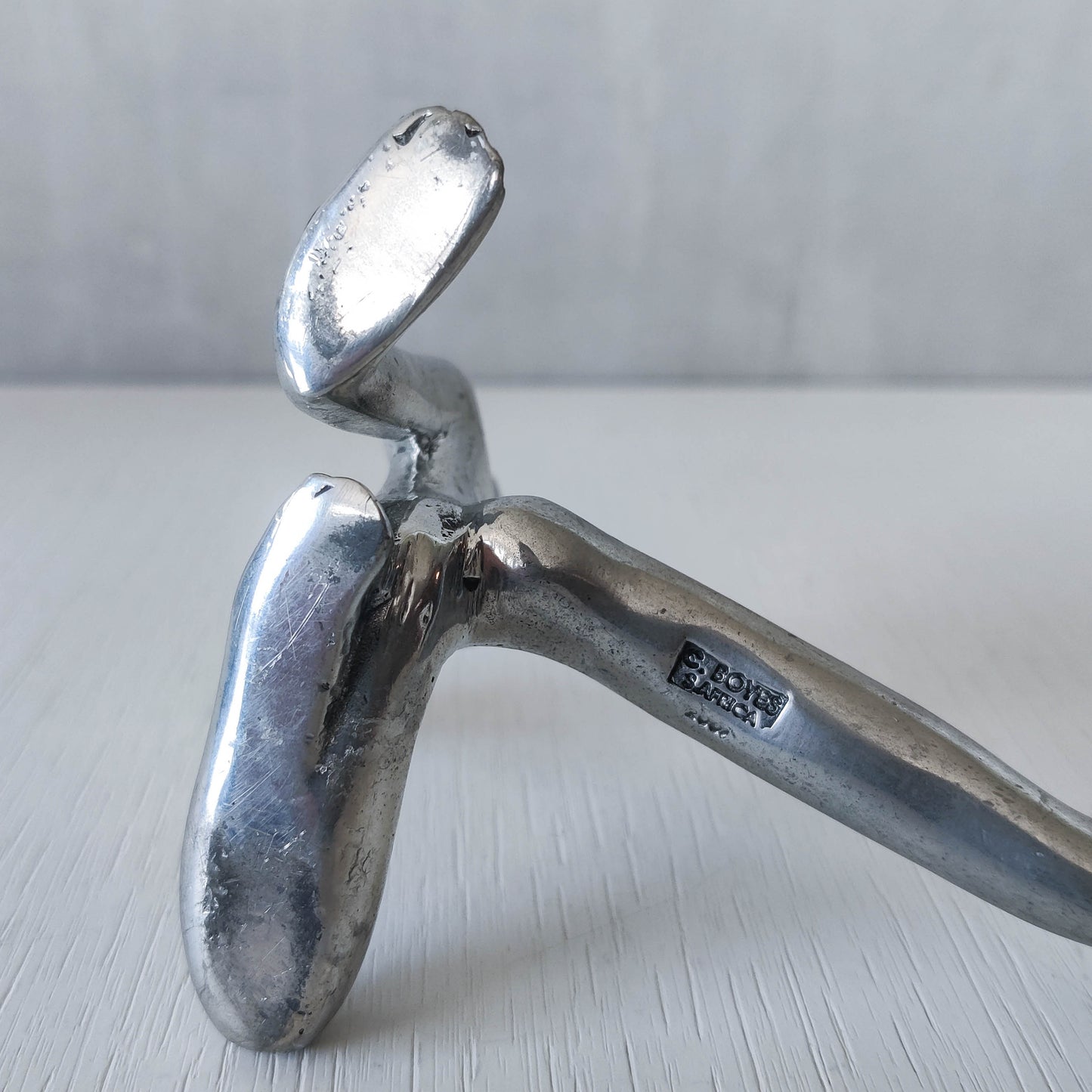Carrol Boyes vintage 00s cast pewter and folded steel figural book display stand