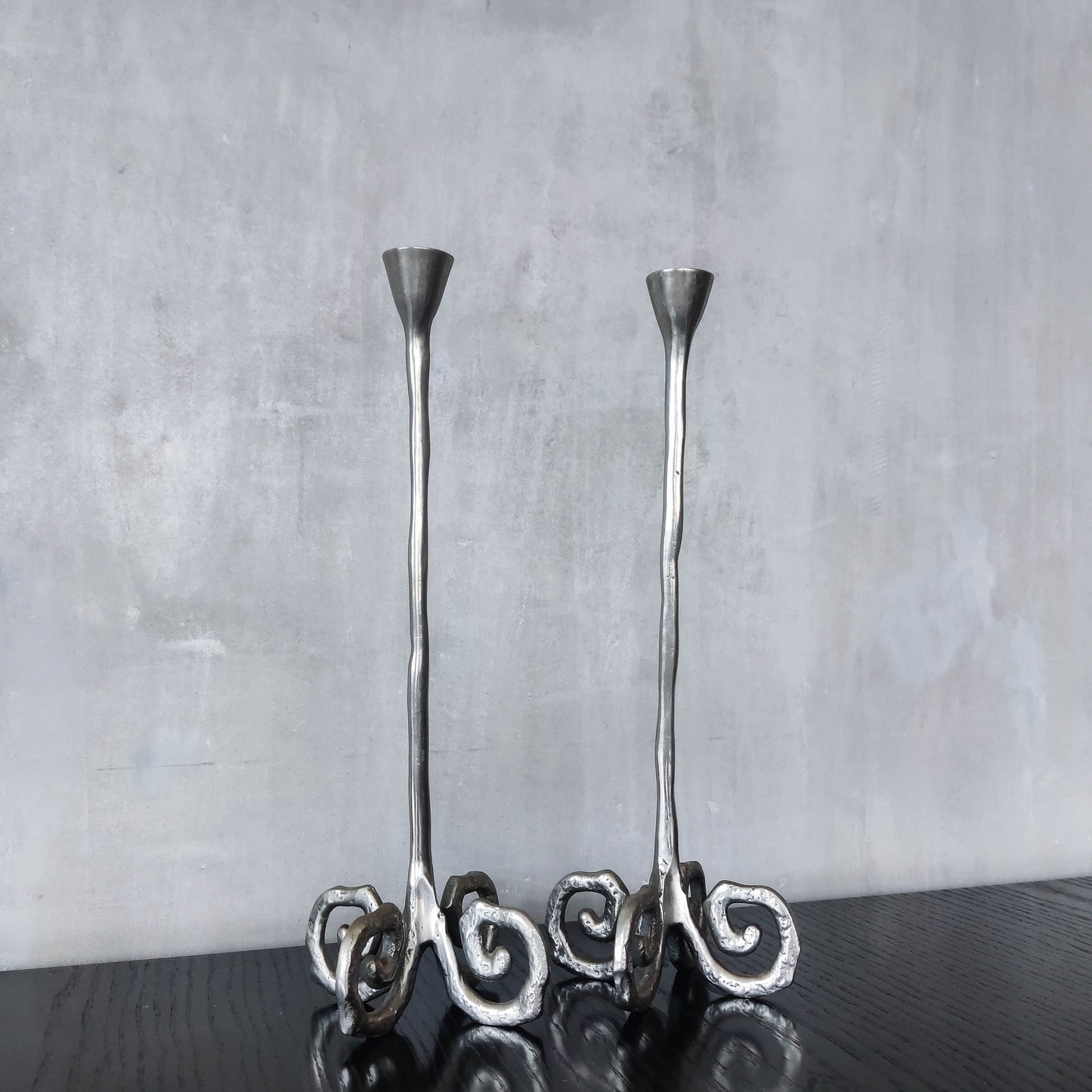 Pair of vintage cast aluminium candle holders with spiral feet