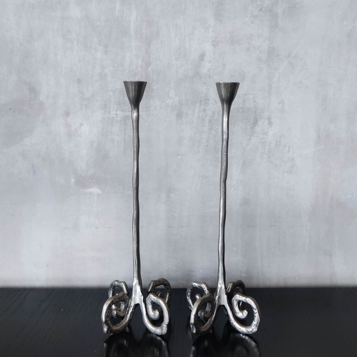 Pair of vintage cast aluminium candle holders with spiral feet