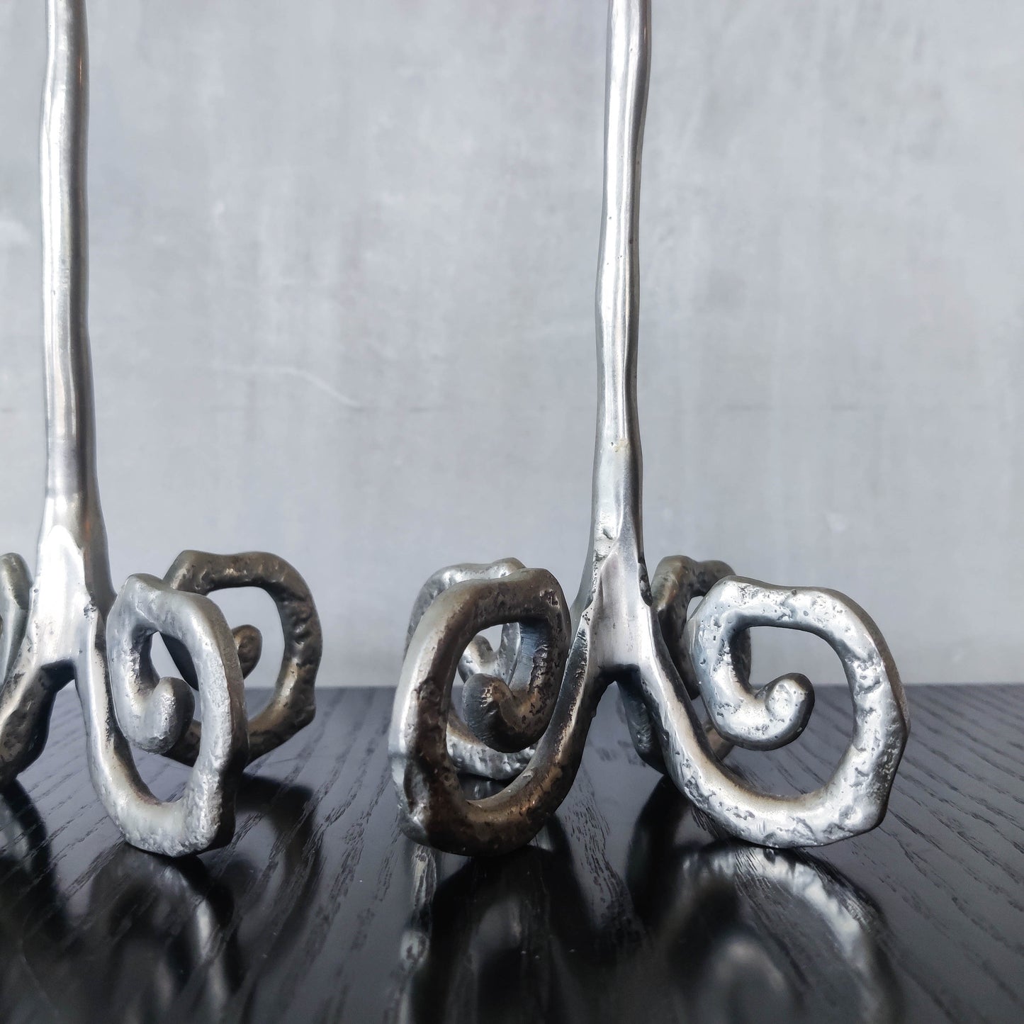 Pair of vintage cast aluminium candle holders with spiral feet