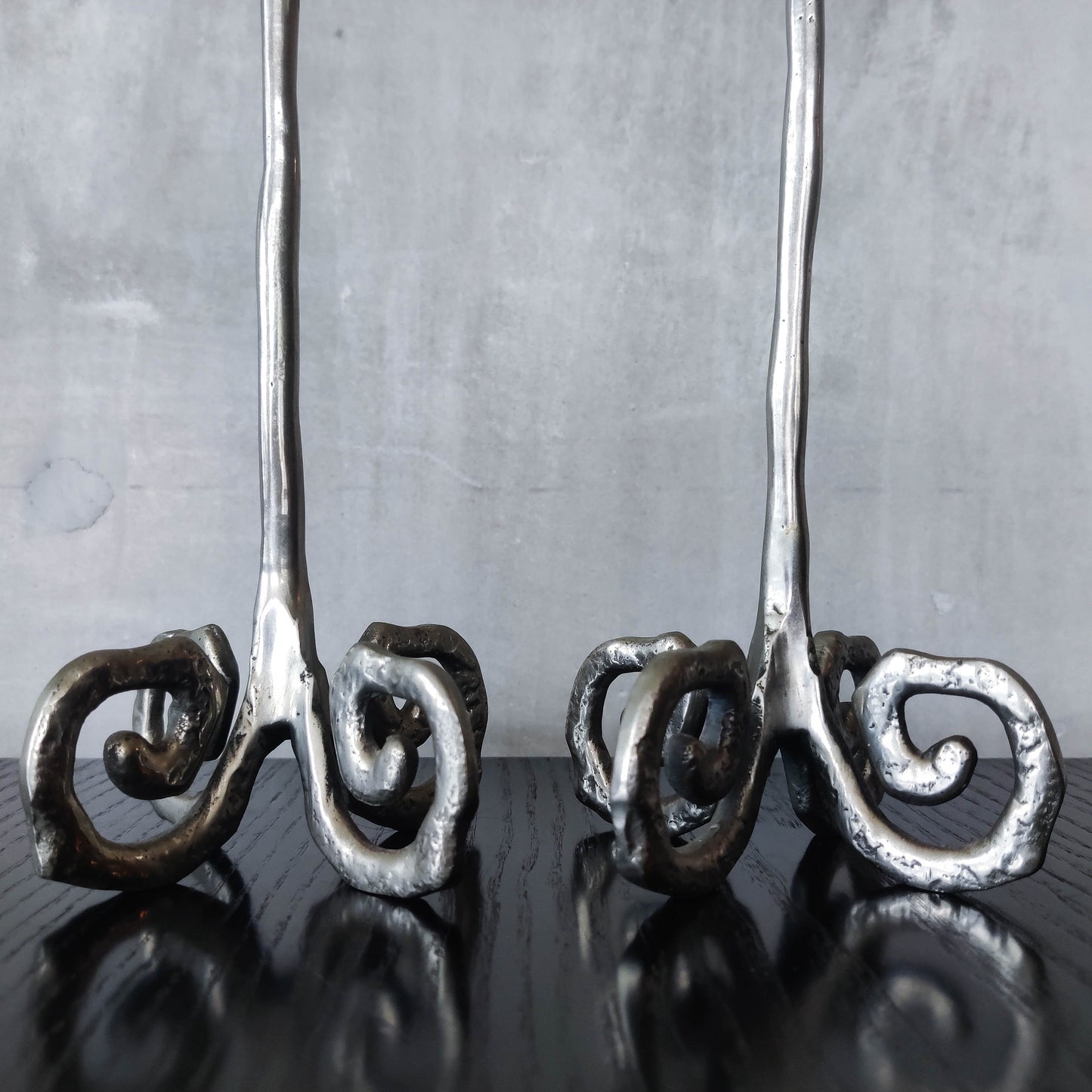 Pair of vintage cast aluminium candle holders with spiral feet