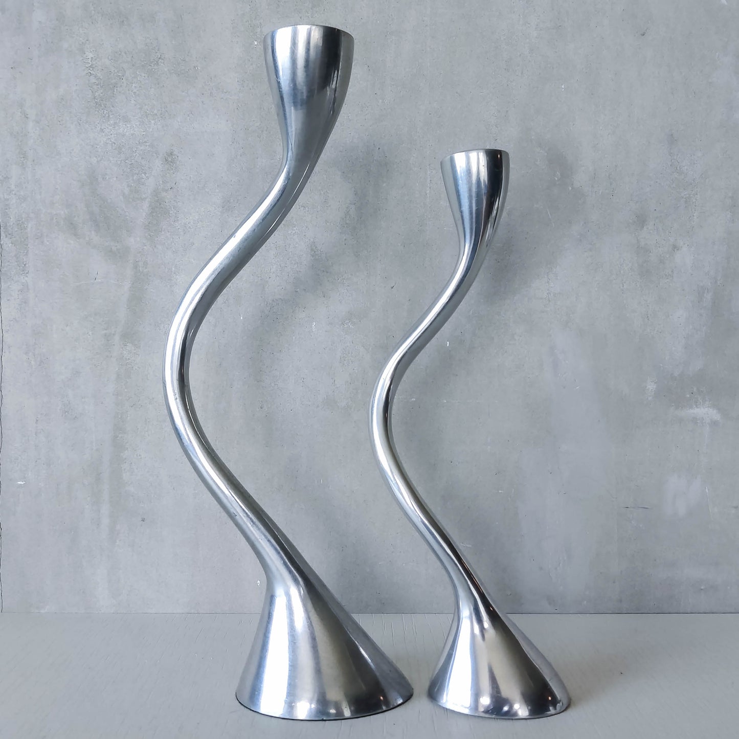 RESERVED Pair of vintage cast aluminium sculptural candle holders wavy