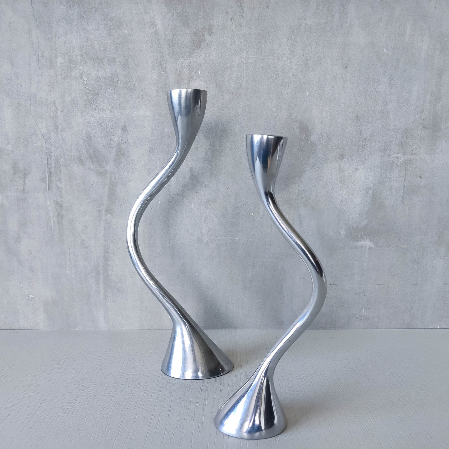 RESERVED Pair of vintage cast aluminium sculptural candle holders wavy
