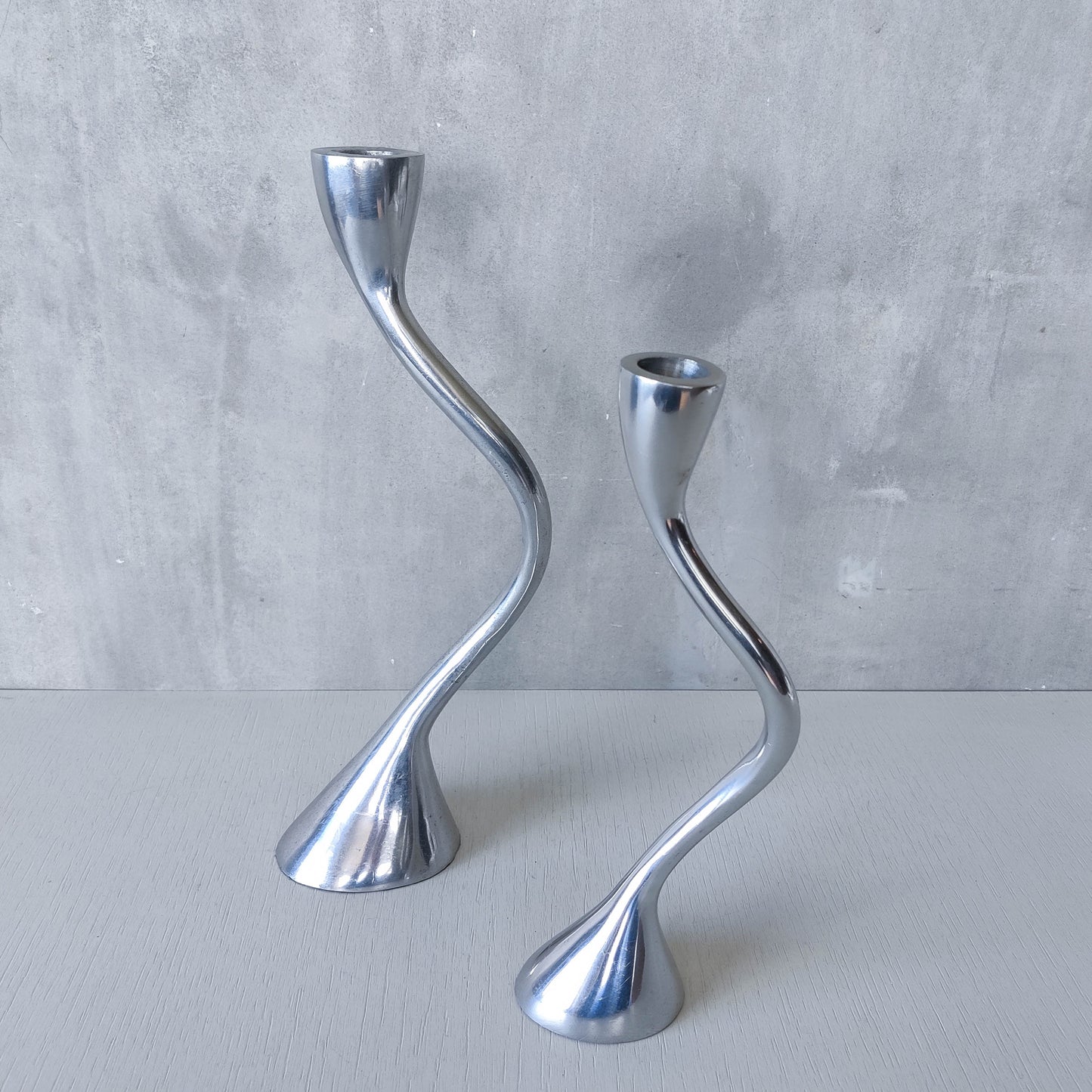 RESERVED Pair of vintage cast aluminium sculptural candle holders wavy