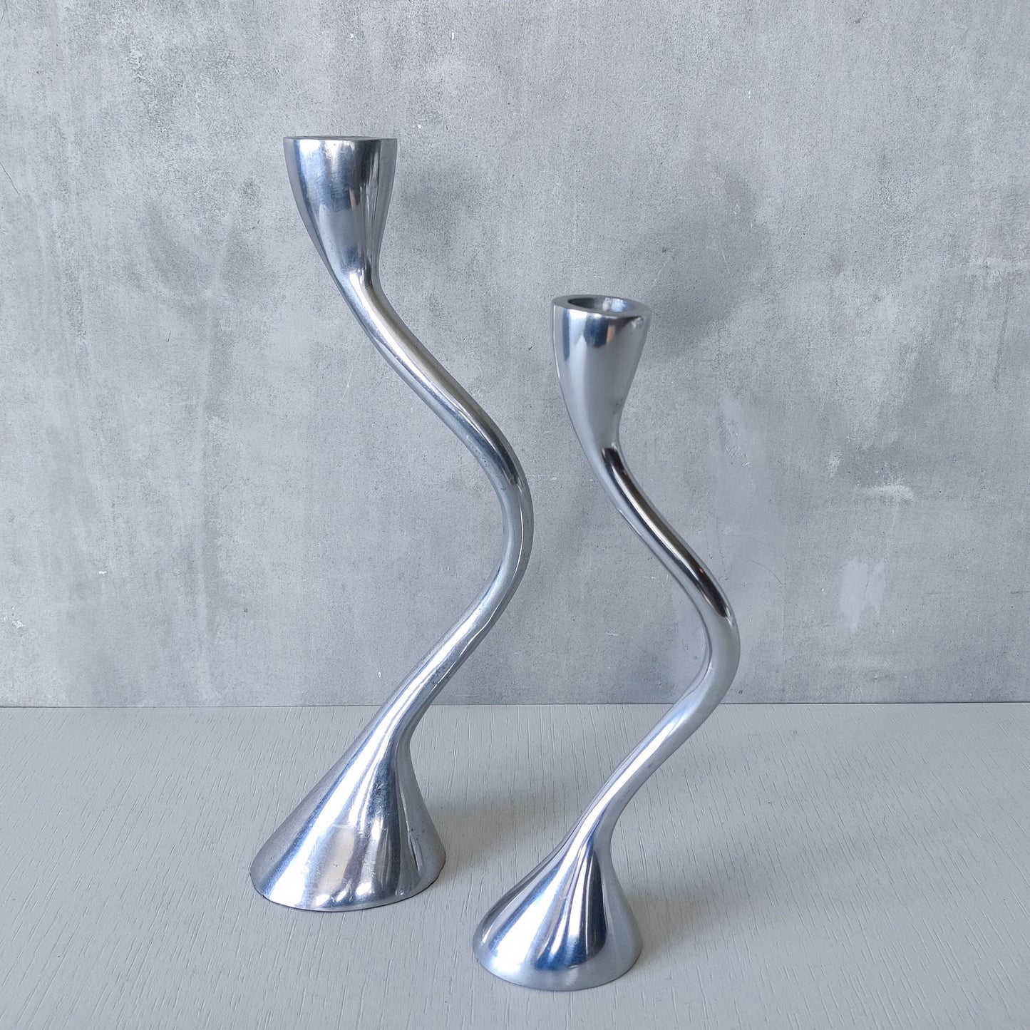 RESERVED Pair of vintage cast aluminium sculptural candle holders wavy