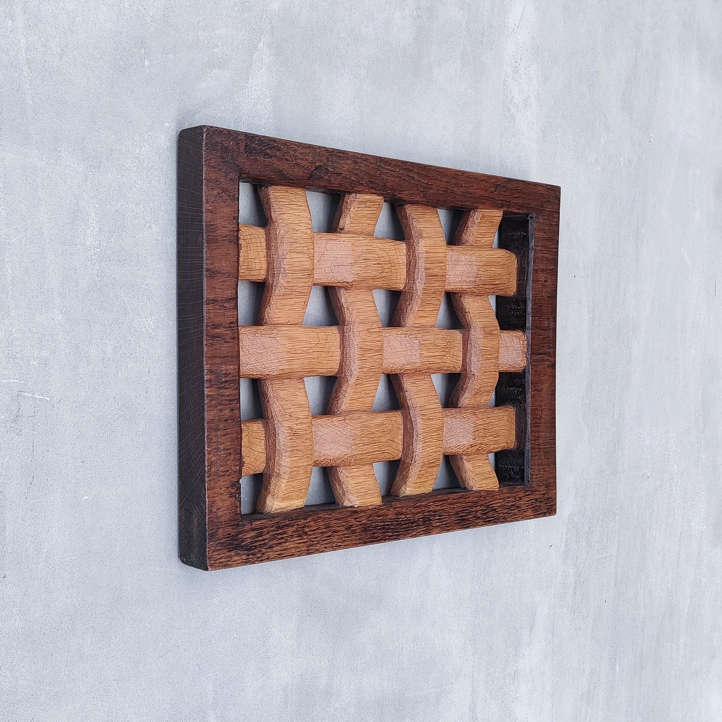 A carved sculptural oak lattice panel wall relief Mouseman studio apprentice piece