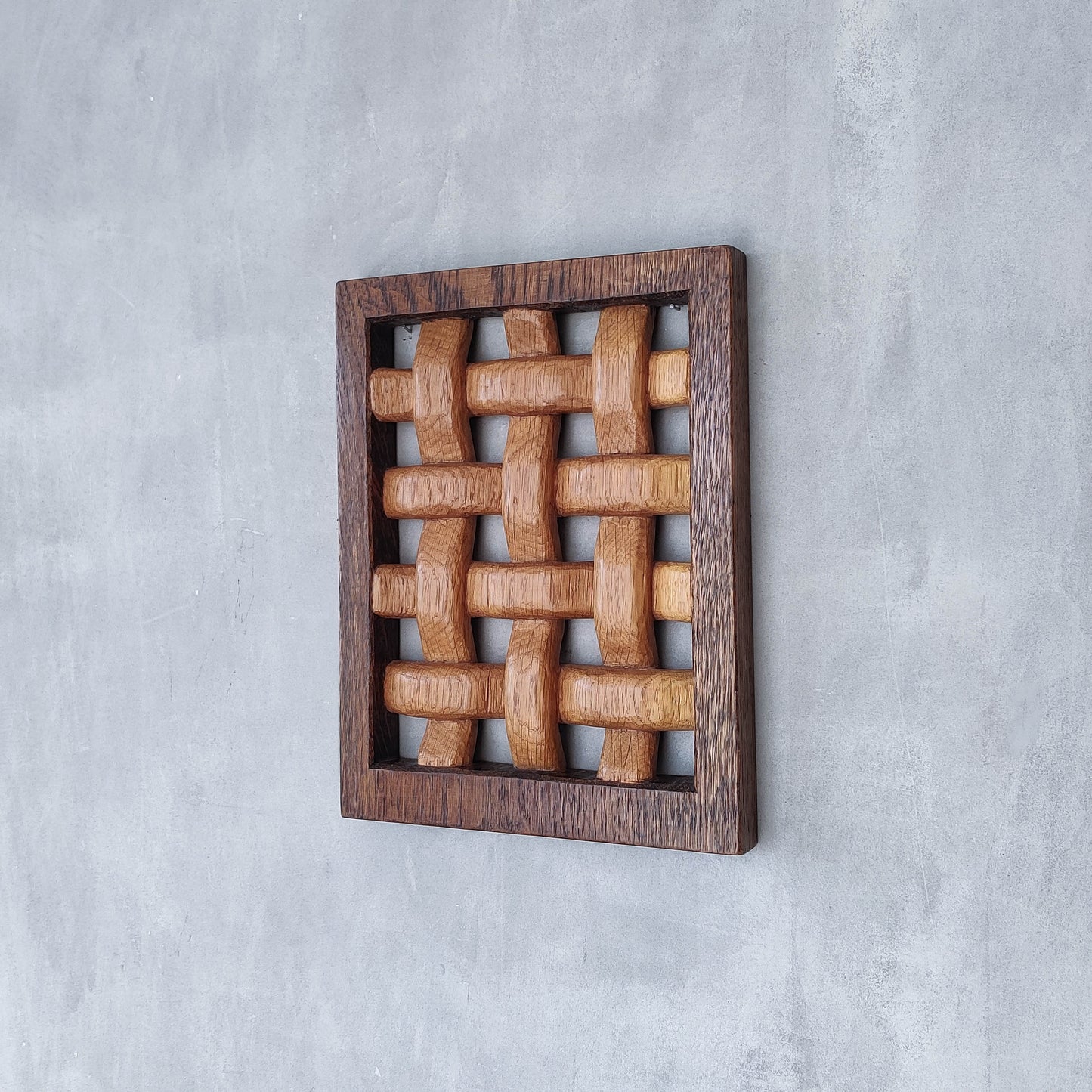 A carved sculptural oak lattice panel wall relief Mouseman studio apprentice piece