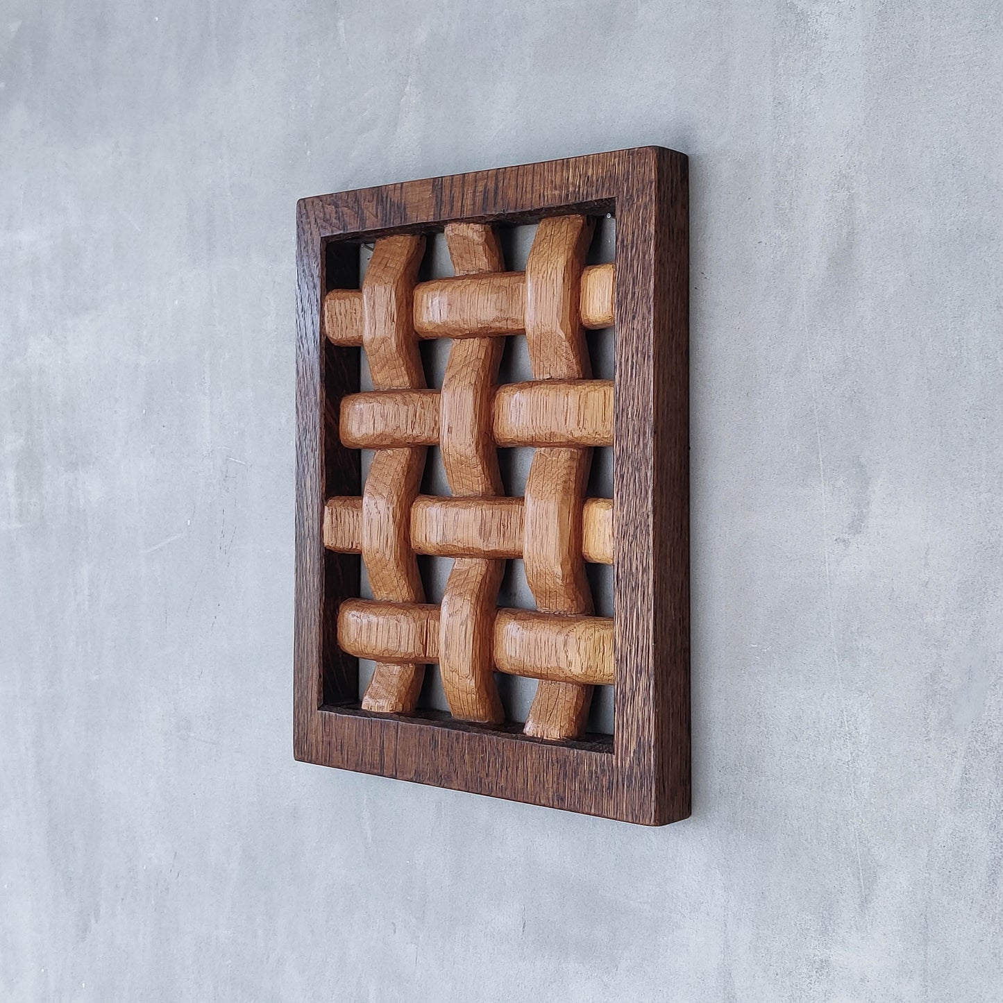 A carved sculptural oak lattice panel wall relief Mouseman studio apprentice piece
