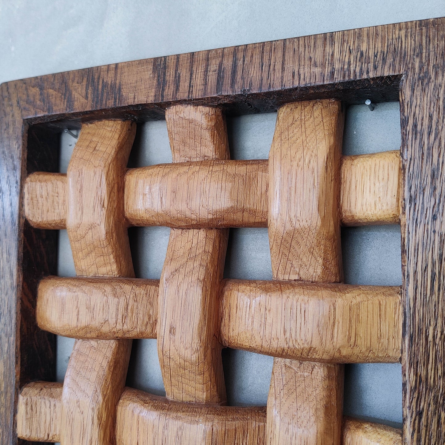 A carved sculptural oak lattice panel wall relief Mouseman studio apprentice piece