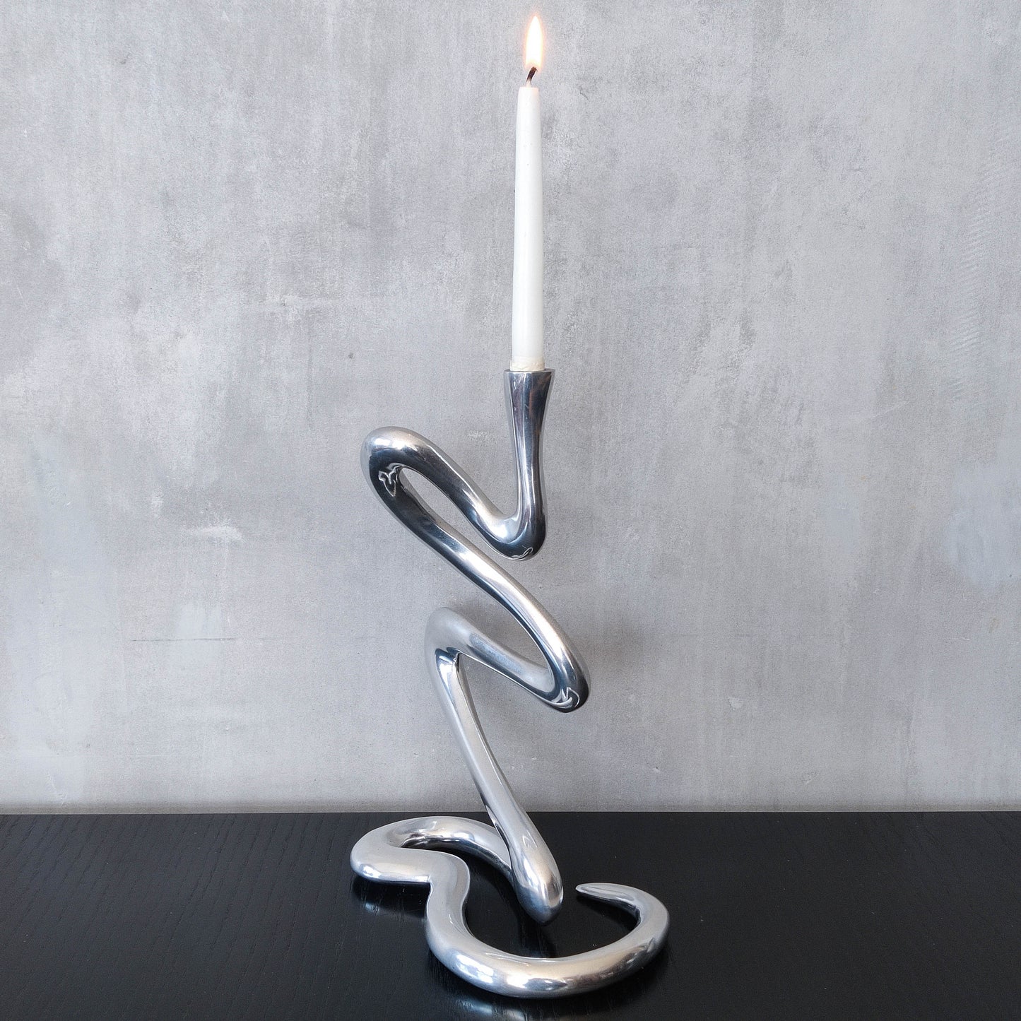 00s cast aluminium sculptural wavy candle holder