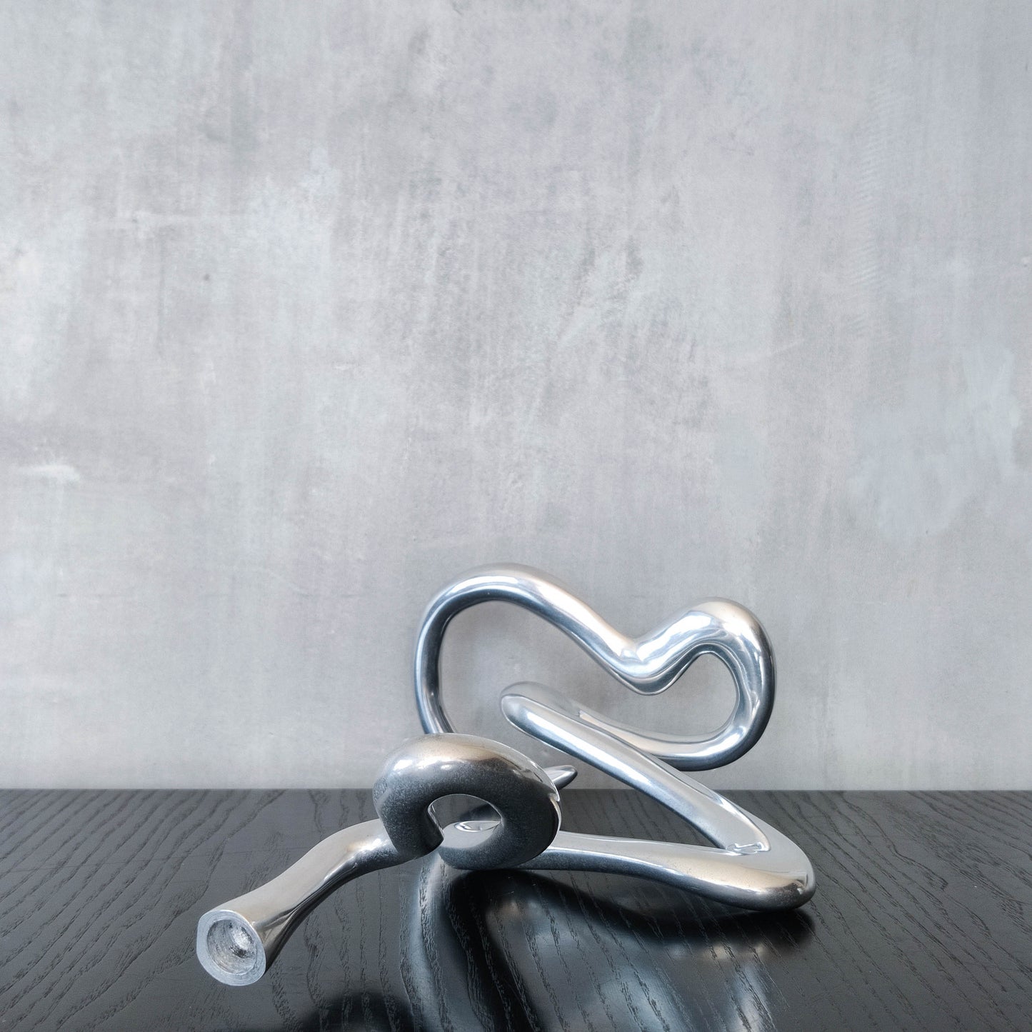 00s cast aluminium sculptural wavy candle holder