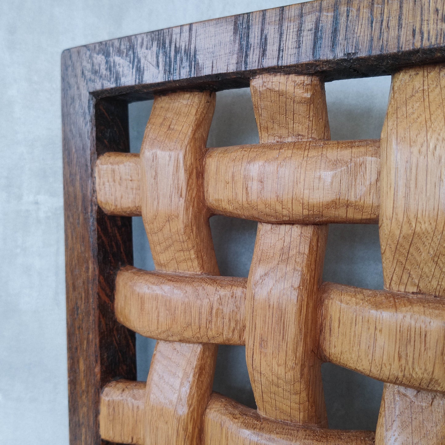 A carved sculptural oak lattice panel wall relief Mouseman studio apprentice piece