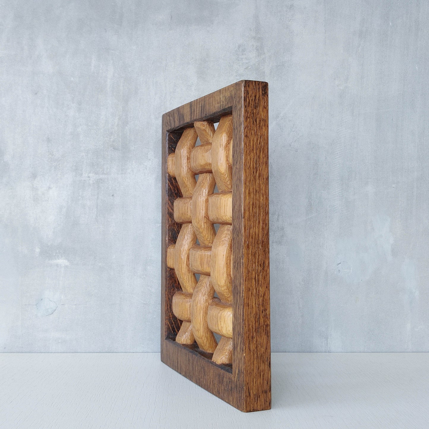 A carved sculptural oak lattice panel wall relief Mouseman studio apprentice piece