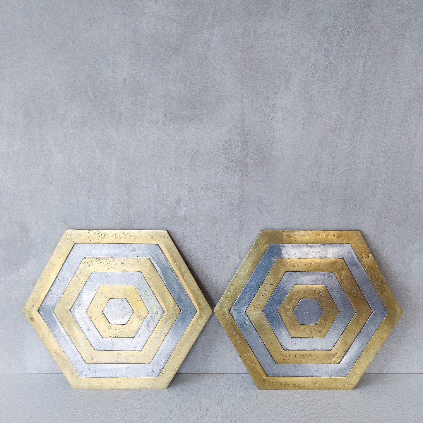 Pair of David Marshall brutalist 1980s large hand cast brass and aluminium large trivets/trays
