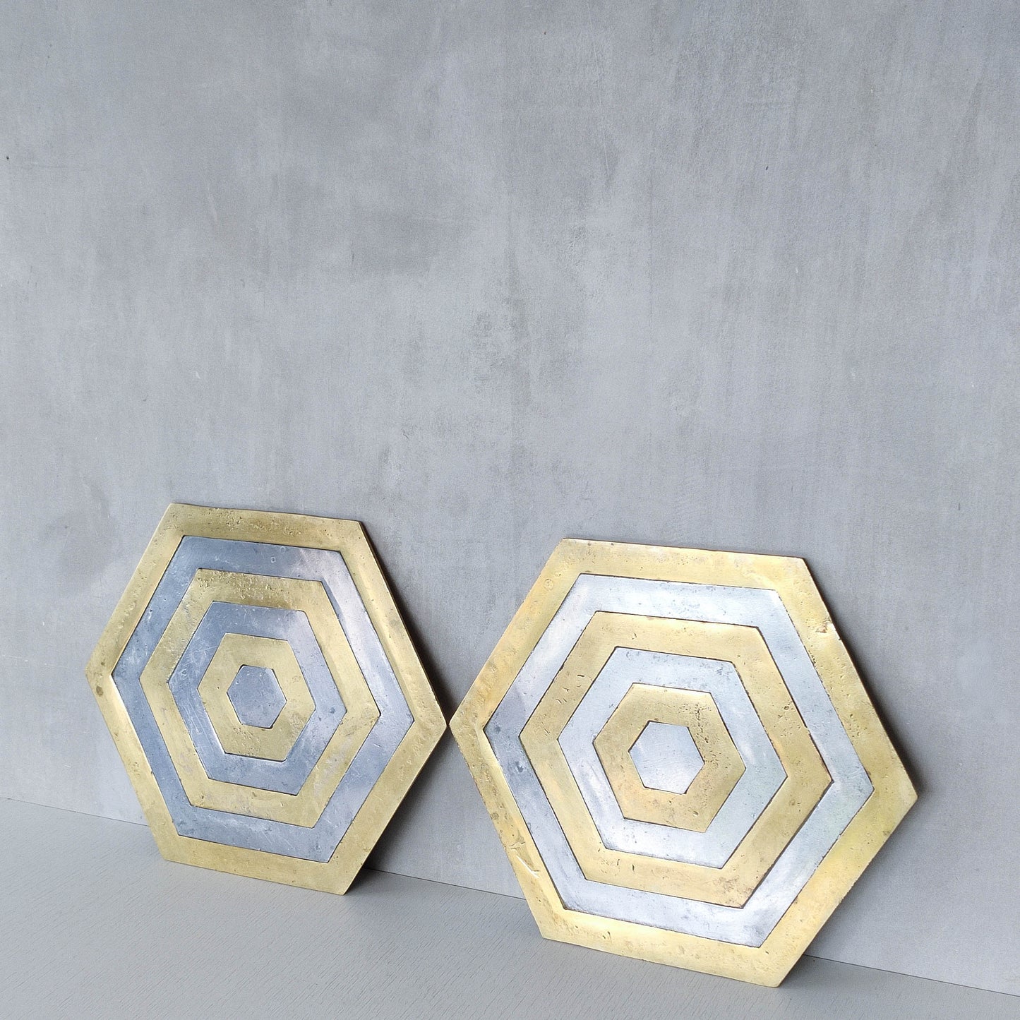 Pair of David Marshall brutalist 1980s large hand cast brass and aluminium large trivets/trays