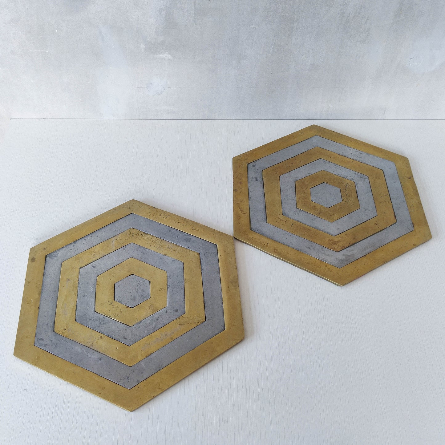 Pair of David Marshall brutalist 1980s large hand cast brass and aluminium large trivets/trays