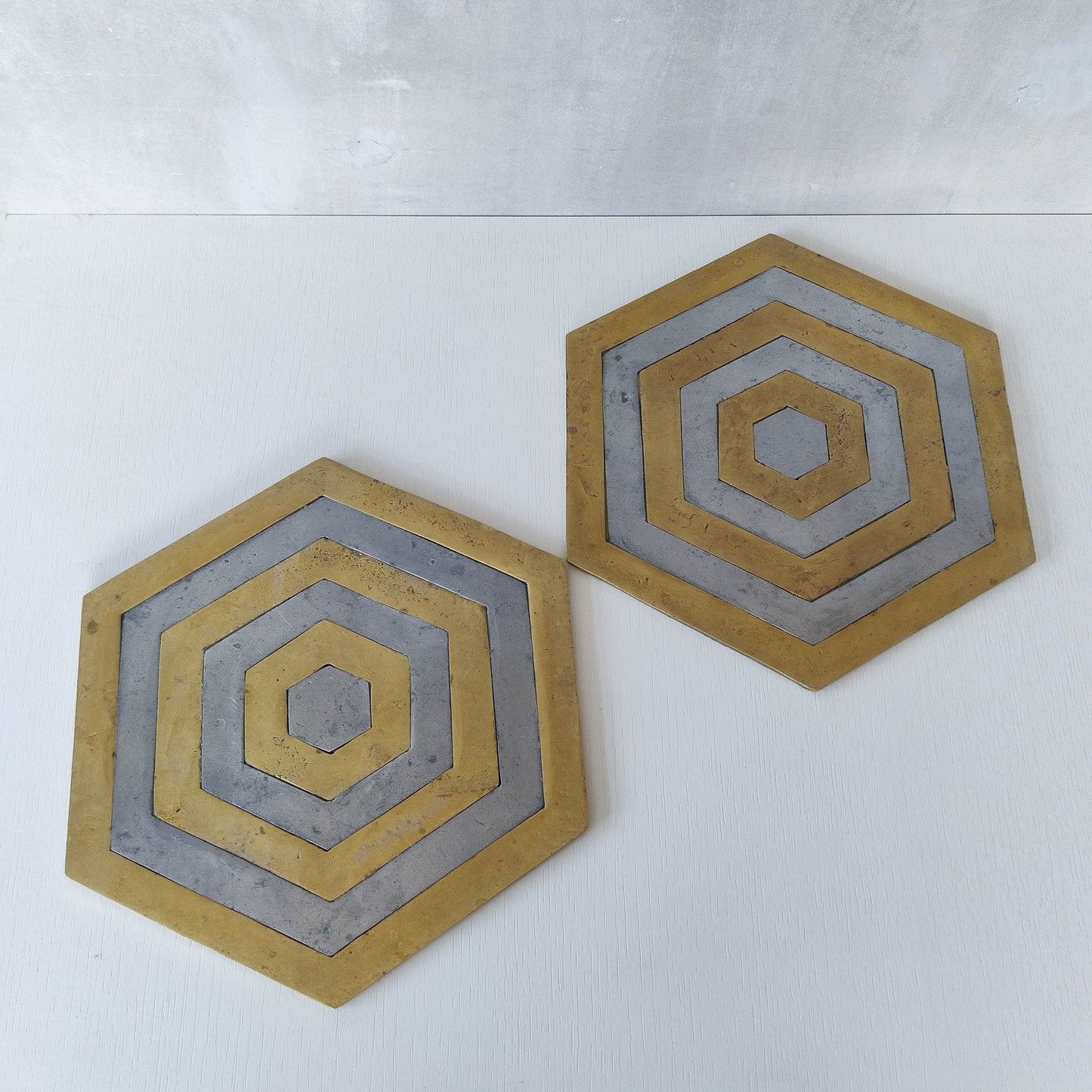 Pair of David Marshall brutalist 1980s large hand cast brass and aluminium large trivets/trays