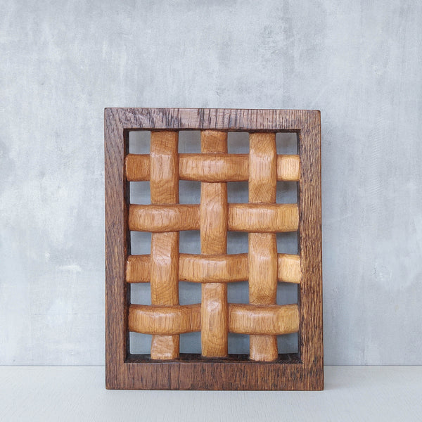 A carved sculptural oak lattice panel wall relief Mouseman studio apprentice piece