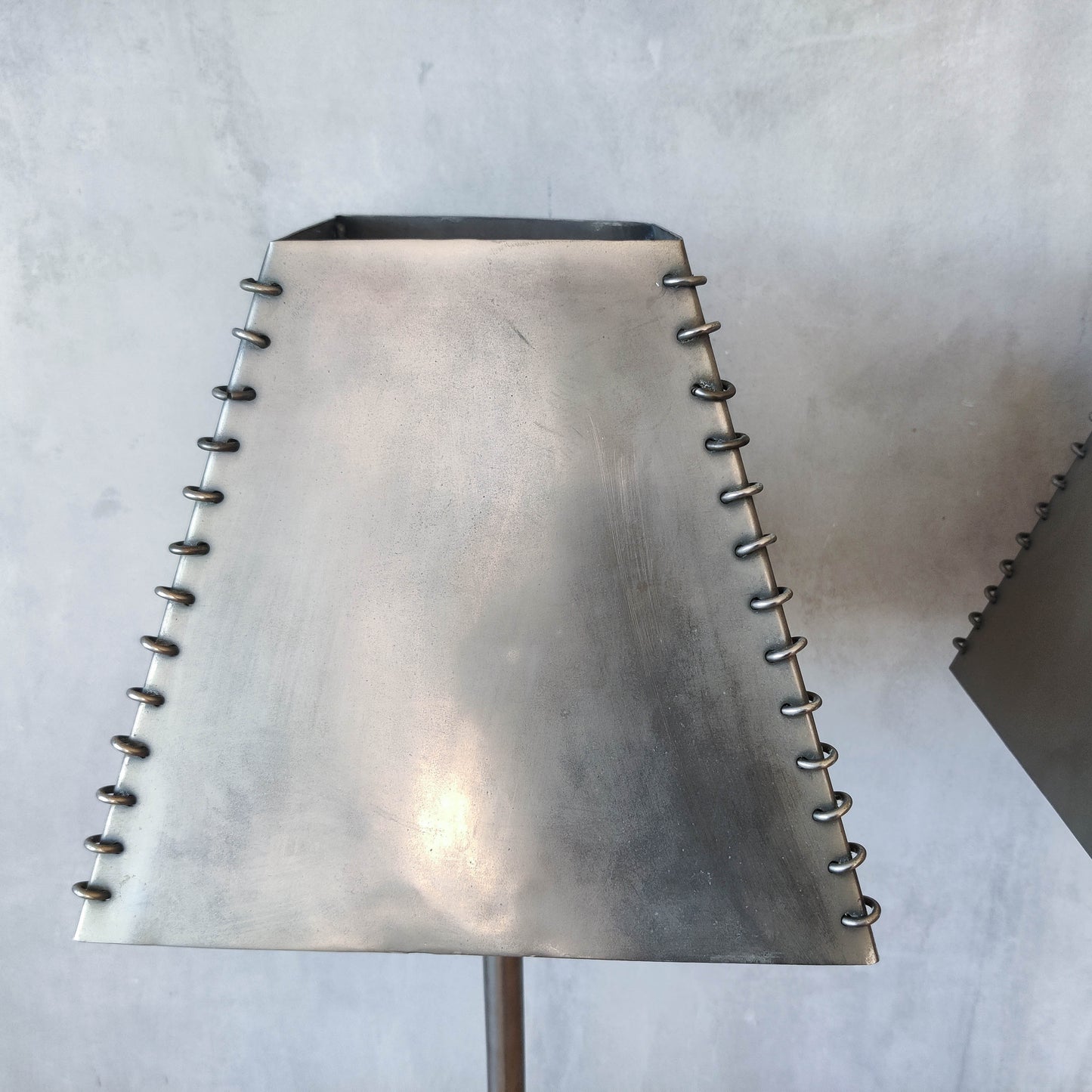 A pair of tall early 1990s Habitat 'Ashrafi' sculptural steel lamps