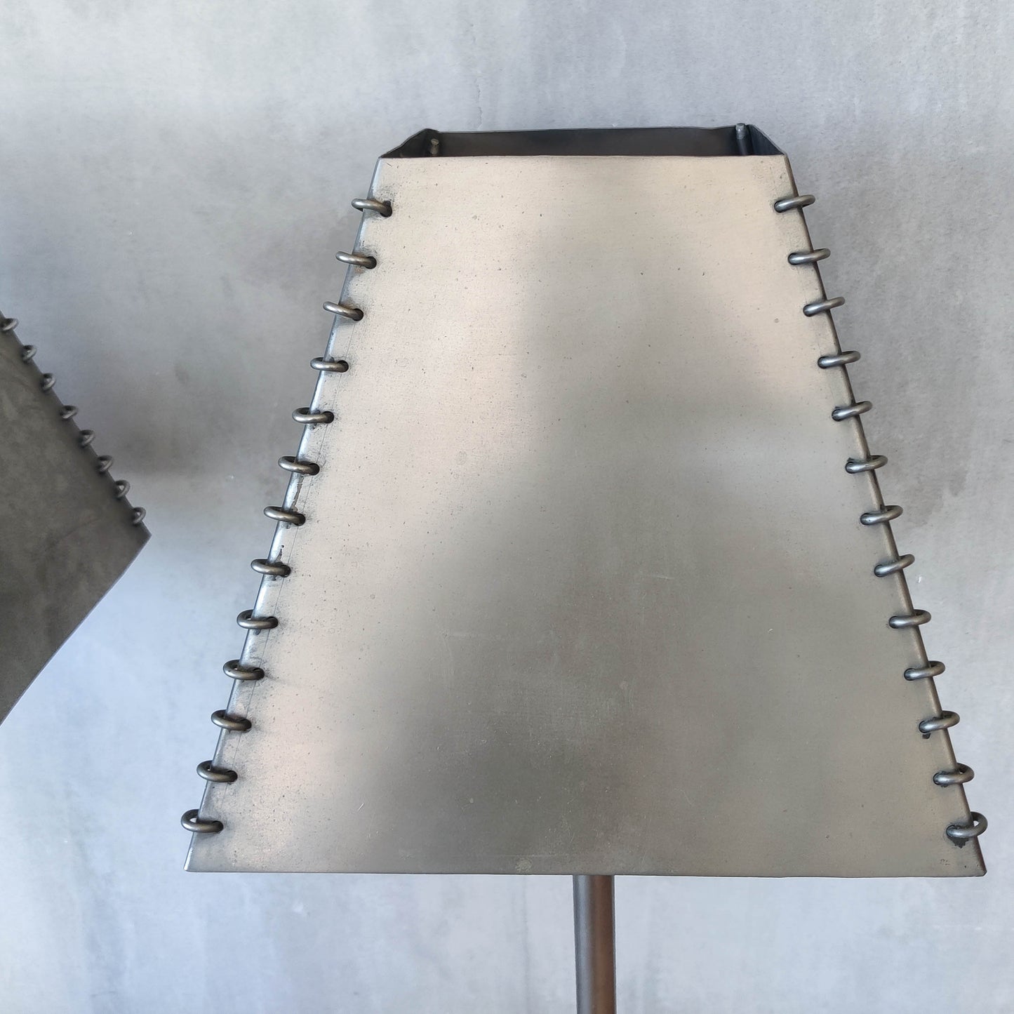 A pair of tall early 1990s Habitat 'Ashrafi' sculptural steel lamps