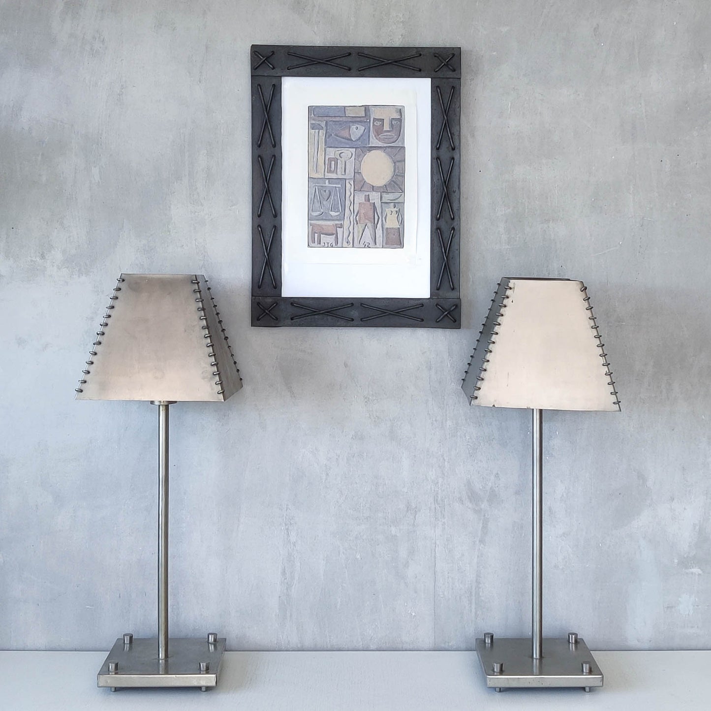 A pair of tall early 1990s Habitat 'Ashrafi' sculptural steel lamps