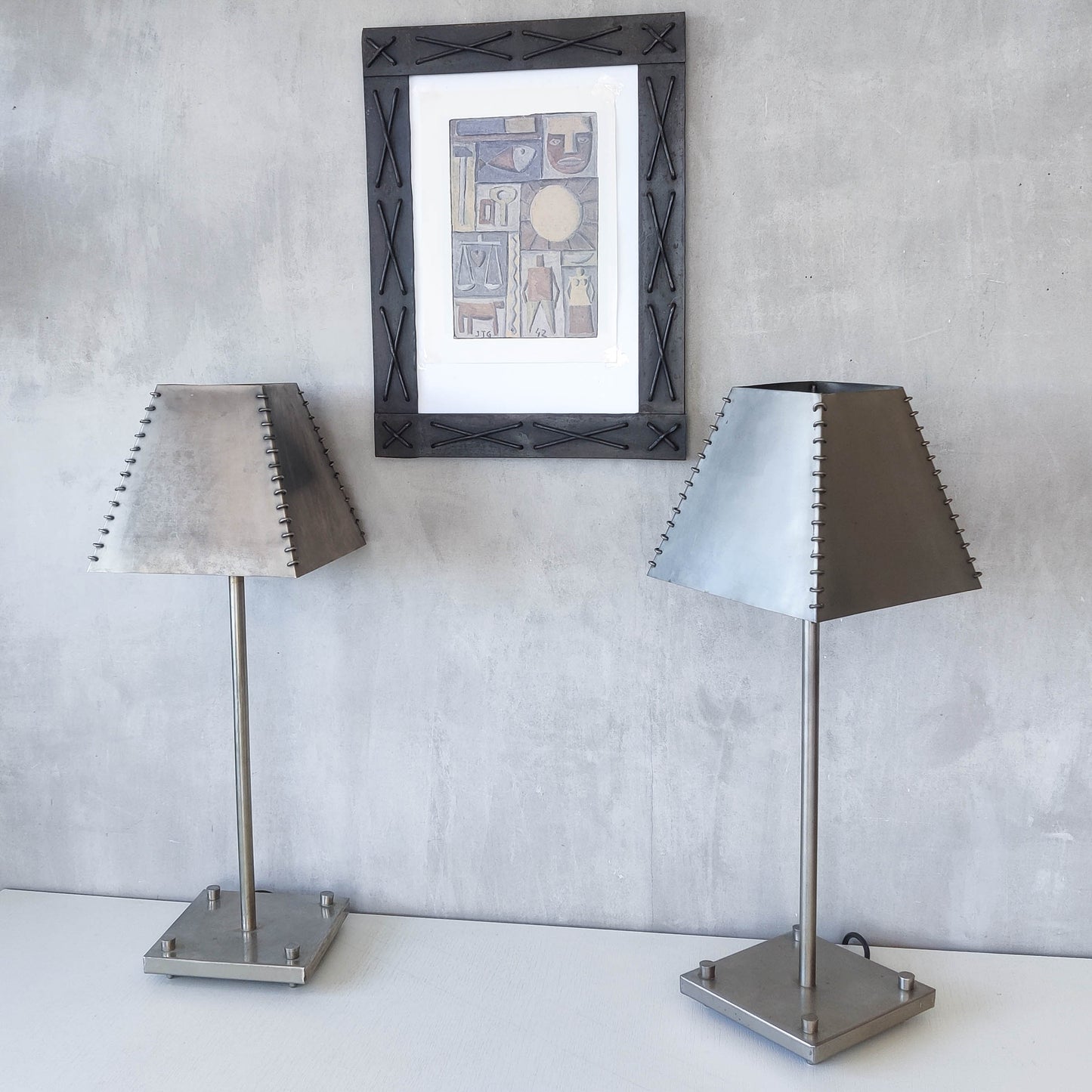 A pair of tall early 1990s Habitat 'Ashrafi' sculptural steel lamps