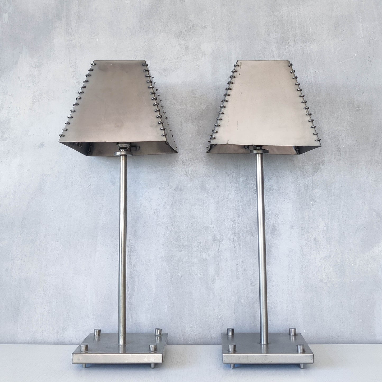 A pair of tall early 1990s Habitat 'Ashrafi' sculptural steel lamps