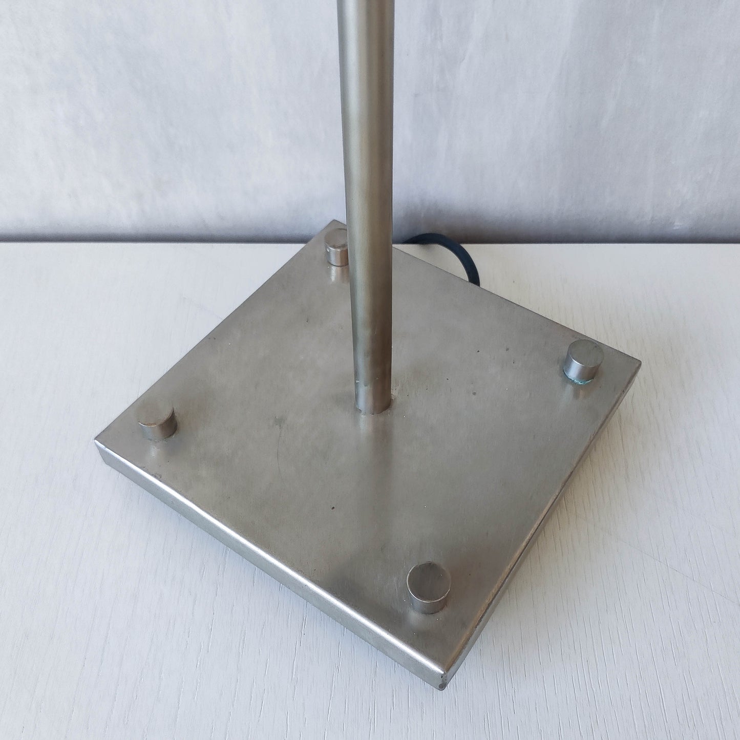 A pair of tall early 1990s Habitat 'Ashrafi' sculptural steel lamps