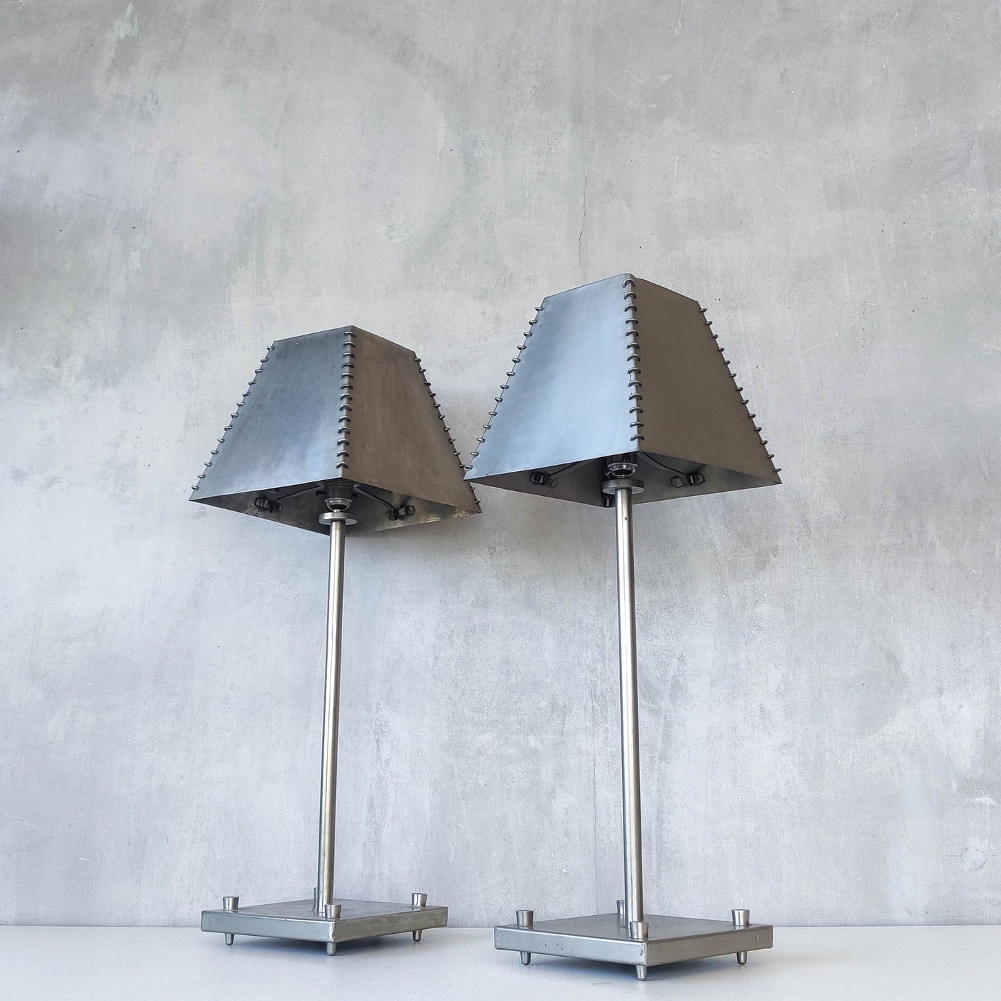 A pair of tall early 1990s Habitat 'Ashrafi' sculptural steel lamps