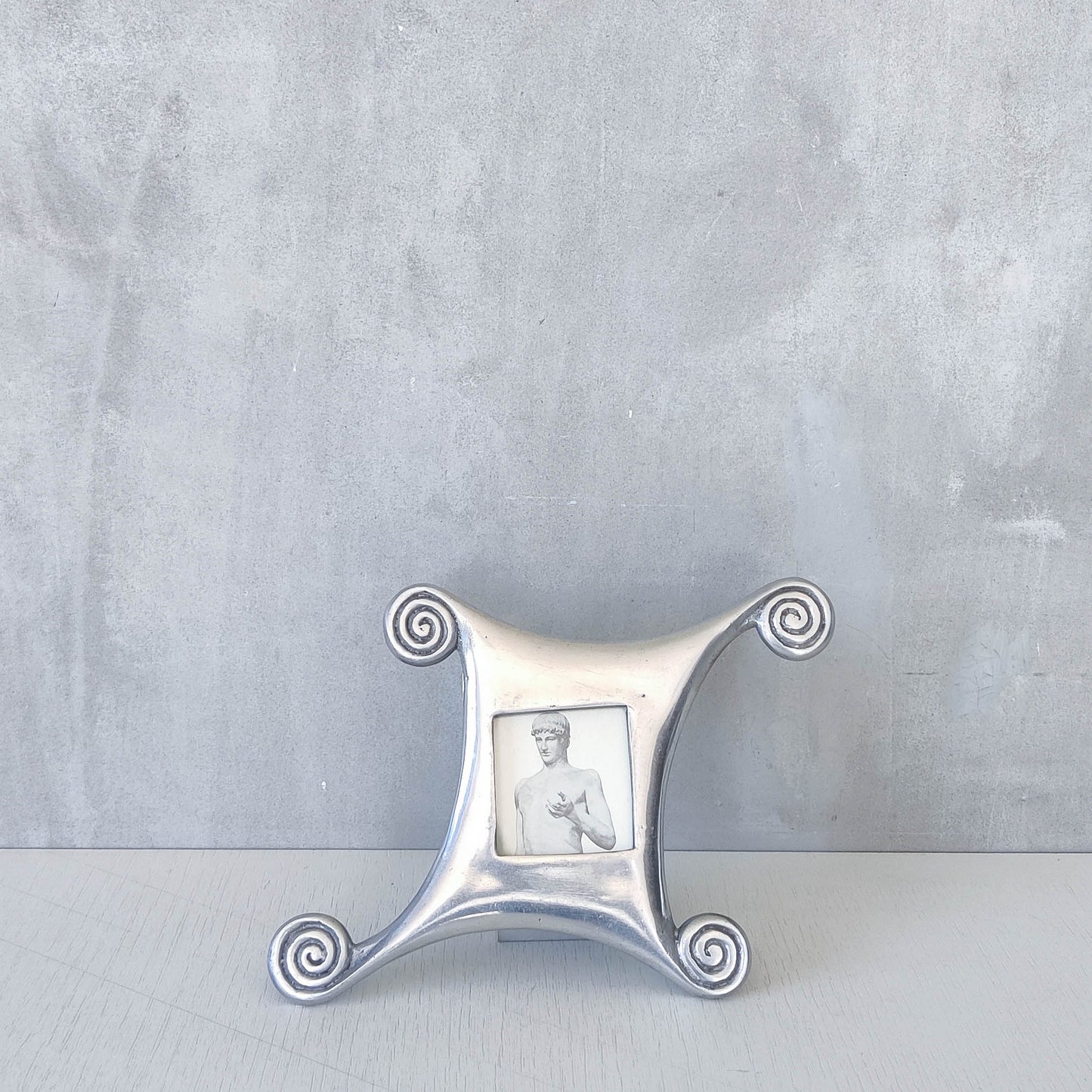 A 1990s cast aluminium photo frame postmodern style with spirals