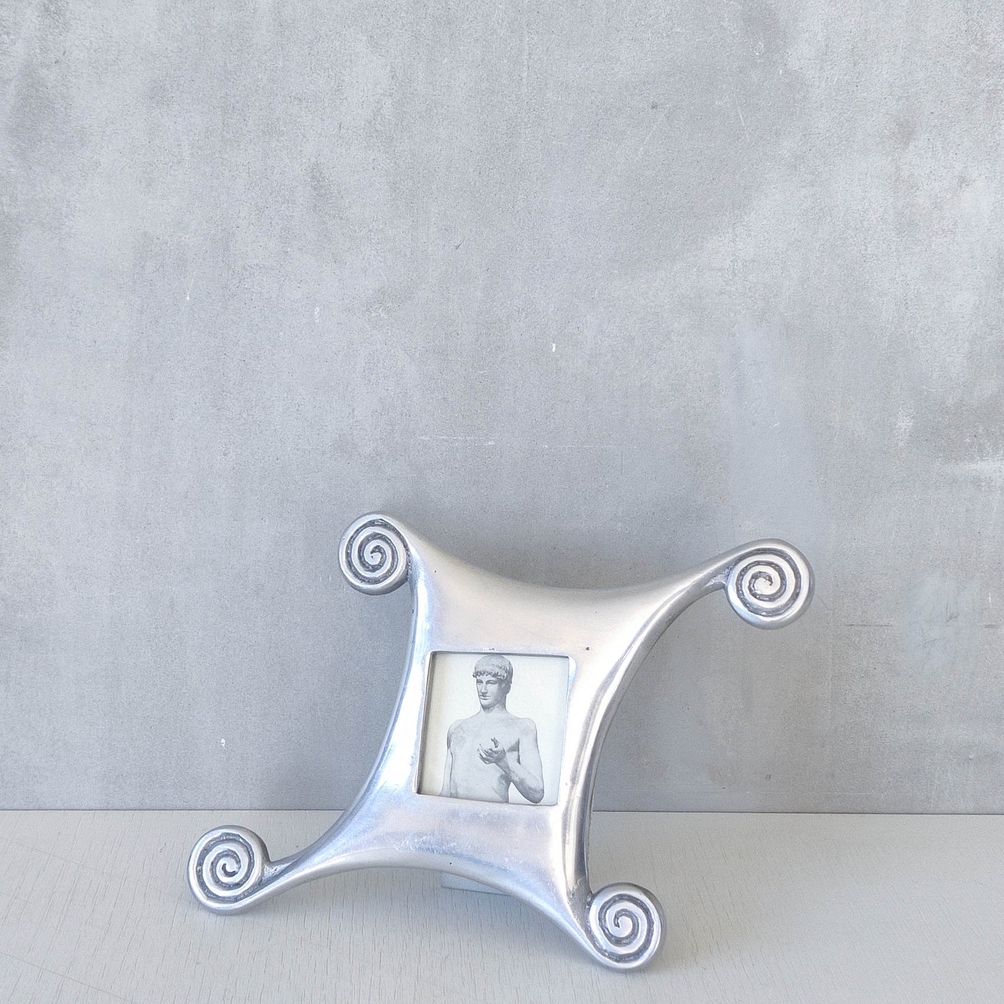 A 1990s cast aluminium photo frame postmodern style with spirals