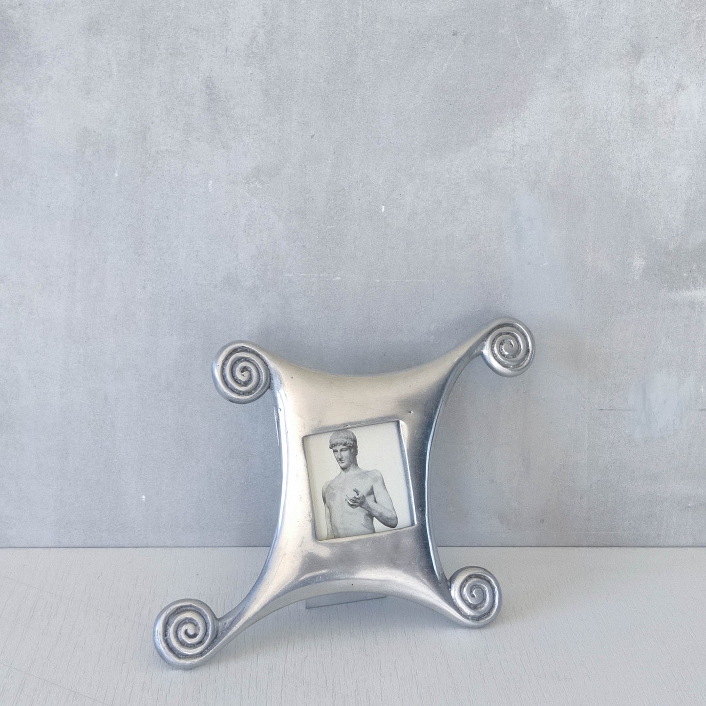 A 1990s cast aluminium photo frame postmodern style with spirals