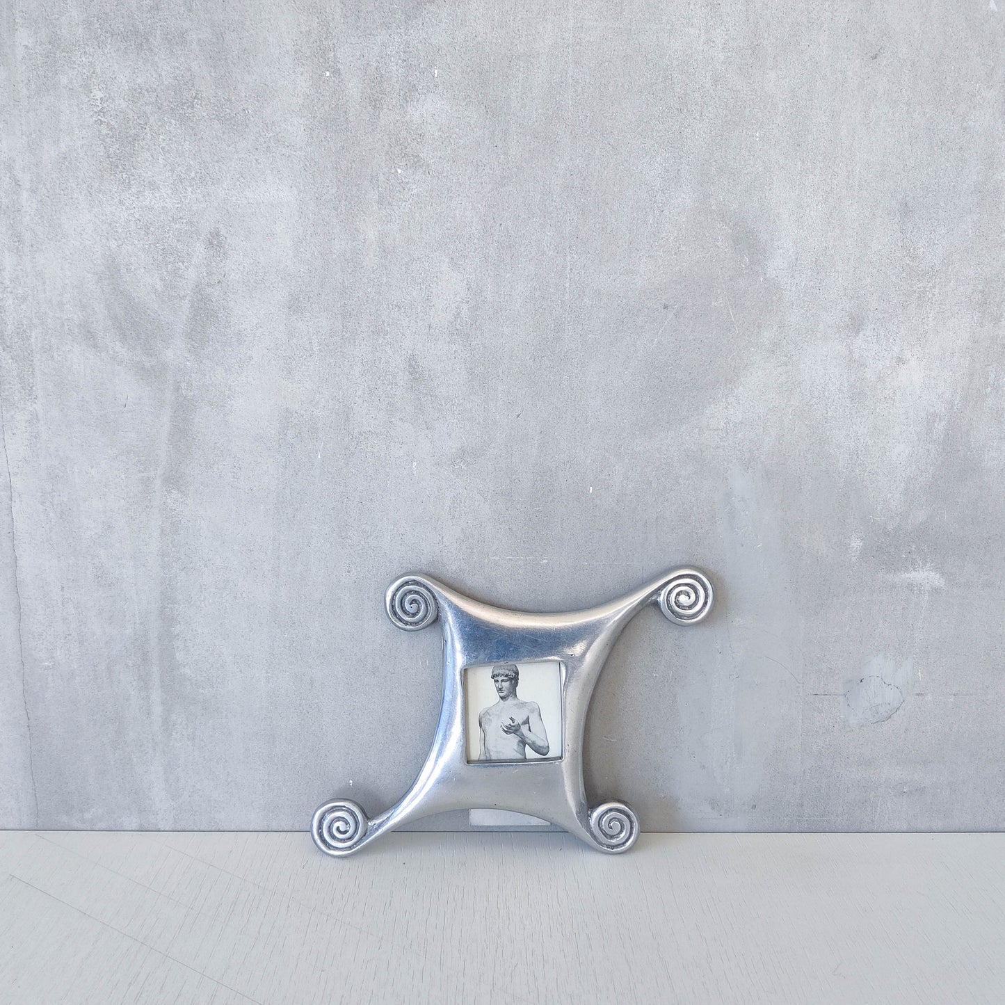 A 1990s cast aluminium photo frame postmodern style with spirals